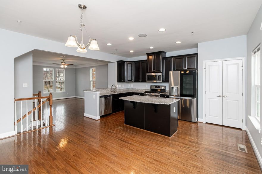 Modern, stylish end unit townhome with over 2,100 SQFT across three levels, offering an inviting open-concept layout with special features that you will love including a dedicated office space, fenced backyard which includes a fire pit, spacious full-size deck, whole-home sound system, the convenience of a bathroom on each floor, and much more.<br><br> 

The entire home has been freshly painted, this home checks so many of your boxes. The main living level, with its low-maintenance hardwood floors, offers a sleek kitchen with new stainless steel appliances, espresso cabinets, granite countertops along with generous living room and dining space that flow nicely onto the deck for expanded outdoor entertaining or simply relaxing. <br><br> 

Three bedrooms upstairs on 3rd level where you’ll conveniently find the washer and dryer (you’re welcome). The primary bedroom impresses with tray ceiling, spa-like ensuite and generous walk-in closet.  It keeps getting better—the 1st floor entry level has a flex space you can use as your lifestyle requires, and the flex space is in addition to the already dedicated office space; you’ll also access the backyard and your two rear parking spaces from the 1st floor. Great location, minutes to eateries and recreation, check out photos. Schedule your tour today and easily apply online.