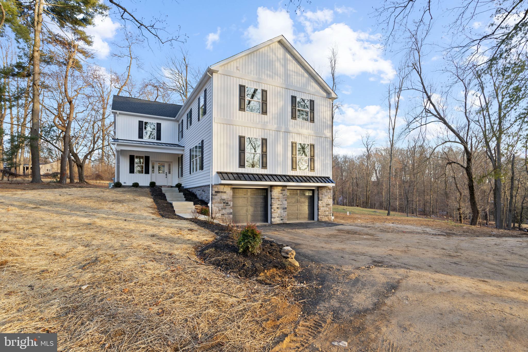 A Must-see Newly Built Garnet Valley Home! Situated on over 3 acres in the Garnet Valley School District, This Custom Built Home is Absolutely Stunning. The former rancher was taken down to the foundation and a fabulous 4BR, 4 Bath house with an expanded footprint boasts views and a setting that cannot be matched. This modern but classic home features large windows to maximize the stunning view and upscale finishes. Large living spaces on the first floor include a space for an office or second living area apart from the kitchen/dining family room which provides the opportunity for a generous work-from-home or entertaining area. Four bedrooms and three full baths on the second floor afford privacy and additional wooded views. The walkout daylight basement is unfinished and roughed in for future bath and plenty of room for storage. Quiet Ivy Mills Road feels a world away, but is close to shopping, the Wawa Train Station, Media, West Chester and Wilmington, and all major highways. This stunning wooded setting feels like the mountains, but without the drive. Very few lots of this size remain in the area.