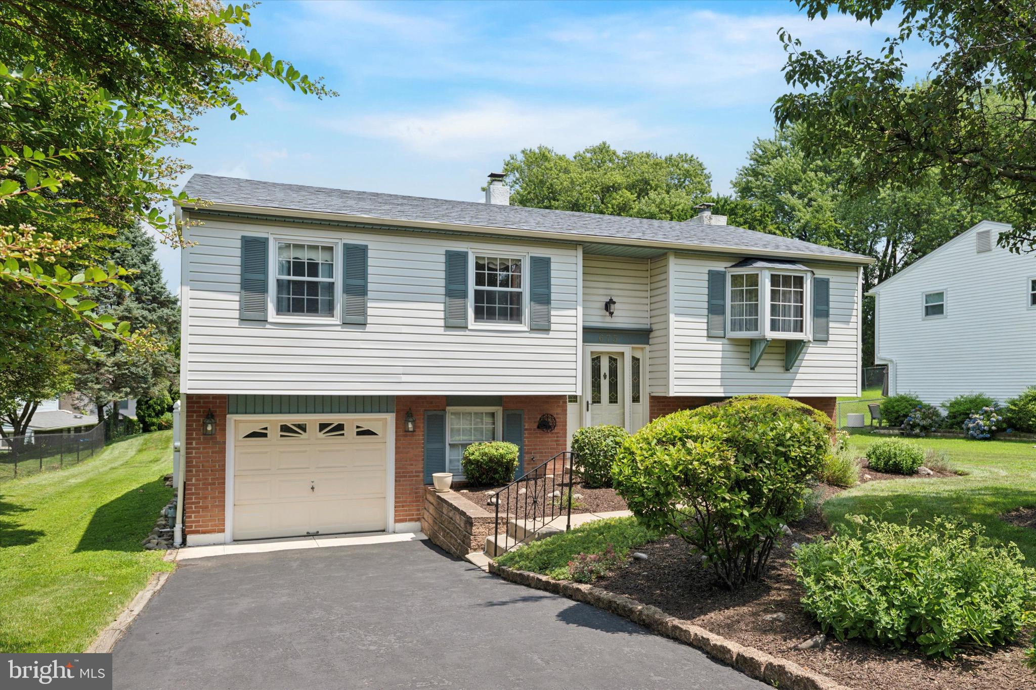 Nestled in the charming Hidden Valley subdivision, this delightful bi-level home offers a perfect blend of comfort and functionality. With 1,924 square feet of thoughtfully designed living space, this residence features four spacious bedrooms and one and a half bathrooms, making it an ideal retreat for those seeking room to grow. Step inside to discover a warm and inviting atmosphere, highlighted by beautiful wood floors and cozy carpeting on the lower level. The eat-in kitchen is perfect for casual dining, while the Formal Dining Room is perfect for Sunday dinners and Holiday celebrations. Gather around the wood-burning fireplace in the family room, creating a cozy ambiance for those chilly evenings. The exterior of the home is equally appealing, featuring low-maintenance brick, vinyl and aluminum siding. Enjoy the serene outdoor space on a generous 0.28-acre lot beautifully landscaped and complete with exterior lighting and street lights that enhance the neighborhood's charm. A built-in garage and driveway parking provide ample space for vehicles, while a handy shed offers additional storage solutions. This home is not just a place to live; it’s a place to create lasting memories. With its inviting interior and welcoming exterior, it’s ready to embrace new owners who will appreciate its warmth and character. Don’t miss the opportunity to make this lovely property your own!