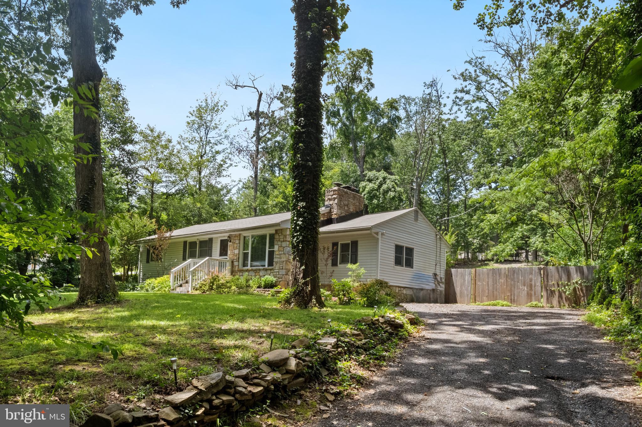 Welcome to this beautifully renovated rambler offering spacious one level living on a serene half acre lot. This 4-bedroom + Den home has been thoughtfully updated throughout, combining modern upgrades with timeless charm.
The stunning kitchen has been completely renovated and features updated appliances, stylish cabinets, granite countertops, and updated fixtures, perfect for cooking and entertaining. Both full bathrooms have been refreshed with new tile, vanities, and contemporary fixtures for a sleek, clean look.
Freshly painted inside and out, the home also features updated flooring throughout and a showstopping stone fireplace with a wood-burning insert that creates a cozy focal point in the living room. The spacious primary bedroom includes a walk-in closet.
The bright den or study room offers flexible space for working from home or relaxing. Step outside onto the brand new deck, ideal for outdoor dining or unwinding in the peaceful backyard.