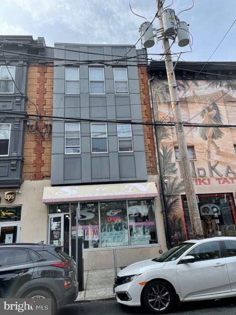 This sale includes two buildings, their addresses are 612-614 S 4th St. There are 8 residential apartments and 2 stores total of 10 units. The residential apartment using the entrance from Leithgow St. It is in the most popular area in the city and in walking distance to the historical old city places such as the Liberty Bell and Constitution Center etc.
This high traffic, double wide 8000 square foot Queen Village building spans from 4th Street to Leithgow Street and contains eight high end completely renovated apartments (four two bedrooms, and four bi level one bedrooms) and 2 commercial spaces with credit tenants, with long term leases ( currently the UPS store and a Nail salon), all completely rented. This building offers a True 6% cap rate, and a much higher cash on cash return than having your money in the bank, with upside every year. These spaces were gut renovated in 2014-2015 and equipped with high end everything including hardwood floors, granite, stainless and cherry kitchens, gorgeous designer tile bathrooms, central air conditioning, multiple fiberglass roof decks, video intercoms, and the entire buildings are sprinklered and alarmed. There is a private, gated entrance for the tenants on Leithgow Street, and the stores have multiple means of egress. All of the utilities are separated and the responsibility of the tenants including water.
