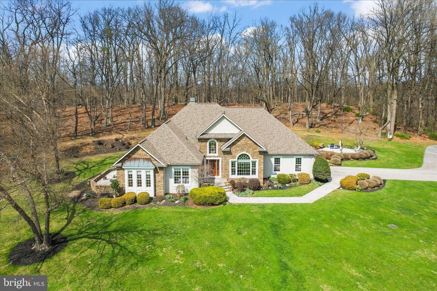 Tucked away on 27 private acres in the beautiful Pigeon Hills, just north of Hanover, this sprawling, custom-built rancher offers the perfect blend of class, comfort, and everyday functionality—all surrounded by rolling fields, wooded privacy, and incredible views.

Inside, you’ll find 3 bedrooms and 2.5 baths, with thoughtful details throughout, including hardwood floors (some with custom inlays), tile, chair rail, crown molding, and a mix of cathedral, vaulted, coffered, and double tray ceilings. Large windows and skylights fill the home with natural light, while two fireplaces add warmth and charm. The spacious kitchen features an island and pantry, and the main-level laundry adds everyday convenience. Entertain with ease thanks to the wet bar and inviting living spaces.

The primary suite is its own private retreat, complete with a spacious sitting area featuring custom built-ins and direct access to a private patio—perfect for quiet mornings or unwinding at the end of the day.

Step outside and enjoy multiple patios and a screened-in porch, ideal for taking in the peaceful surroundings. The land offers a beautiful mix of open space and woods, with trails for riding ATV's or just meandering about! 

Car enthusiasts, hobbyists, or anyone needing extra space will appreciate the attached garage for everyday convenience, a detached garage for additional storage or workspace, and a newer 24x48 pole building with a 14' door and 16' rafters—perfect for storing boats, campers, equipment, or all your outdoor toys. There’s also plenty of paved parking to accommodate it all with ease.

For added peace of mind, the home is equipped with a generator capable of powering essential systems during an outage.

With room for horses, space for future outbuildings, and endless possibilities, this property offers the privacy, flexibility, and lifestyle you’ve been looking for.