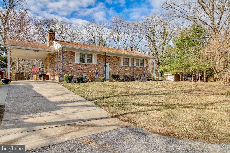 Beautifully updated brick front single family home in BELLEVUE ESTATES on almost half acre lot.  Enjoy the separate dining room with patio doors that open on both sides. You will love your large deck overlooking the spacious backyard.  This home is move in ready. Lower level has a fireplace, 2 family living room areas, one equipped with a movie theater set up for your entertaining needs.