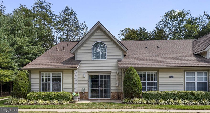 Adult 55+ Community Living in the Heart of Eldersburg! Welcome to this charming and well-maintained 2 bedroom, 2 bath condo in sought-after Winifred Manor, offering both privacy and comfort at the end of a quiet, no-through street. Conveniently located near shopping, dining, and the Carroll County Senior Center, this home is move-in ready and waiting for you.

Enjoy the ease of your assigned parking space just steps from a keyed private side entrance, with abundant visitor parking nearby for guests. Ideally positioned next to the community hall, the property features a 16-foot covered porch backing to mature trees—a peaceful spot to relax and unwind.

Inside, recent updates include new carpet and luxury vinyl plank flooring (March 2024), plus a suite of stainless steel appliances—range, microwave, and dishwasher (August 2025) along with a stainless refrigerator. The spacious kitchen flows seamlessly into the family/dining room combination with soaring cathedral ceilings and direct access to the porch. The primary suite offers an attached full bath and walk-in closet, while the large second bedroom is served by a hall bath and convenient laundry closet.

Residents of Winifred Manor enjoy beautifully landscaped grounds, snow and trash removal, assigned parking, and a fully equipped community center with a party room—the perfect place to gather with friends and neighbors.

This is a wonderful opportunity to enjoy an active yet peaceful lifestyle in one of Eldersburg’s most desirable 55+ communities. Don’t wait—schedule your showing today!