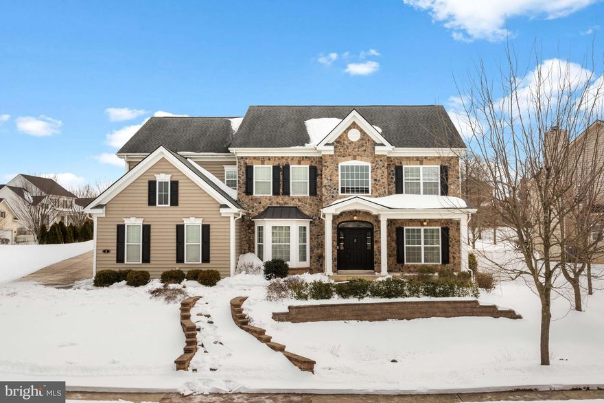 Beautiful corner colonial home in great condition located in a well-maintained executive community of Beechwood Estates. This stone front home has gleaming hardwood floors and carpets throughout the main level. The gourmet kitchen has an abundance of cabinetry, granite countertops, tile backsplash stainless steel appliances and second staircase to 2nd floor. The kitchen overlooks the 2 story great room with a wall of windows, stone floor to ceiling gas fireplace is the focal point of this room. The formal living room and the large dining room which is easily large enough to seat a table of 8 flanks the 2 story foyer with turned staircase. This floor also features a sun room on the main level perfect to have your morning cup of coffee which leads to the backyard. The patio overlooks a pool with hot tub and also has access to a second floor deck!  Fantastic for summer entertaining and for your summer BBQ. The large main level also includes powder room and laundry room with cabinets and access to the 2 car attached garage. The second floor of the home features a large primary bedroom with a sitting room, walk in closet and the en-suite is spacious with double sinks, soaking tub, tiled shower and water closet. There are three additional spacious bedrooms, all with spacious closets, on the second floor and a hall bath with double sinks and tub shower. The fully finished basement has a full bathroom, bedroom AND movie theater room with wet bar. This space is an entertainers dream! Put your own personal touches and this home is ready for you to move in!