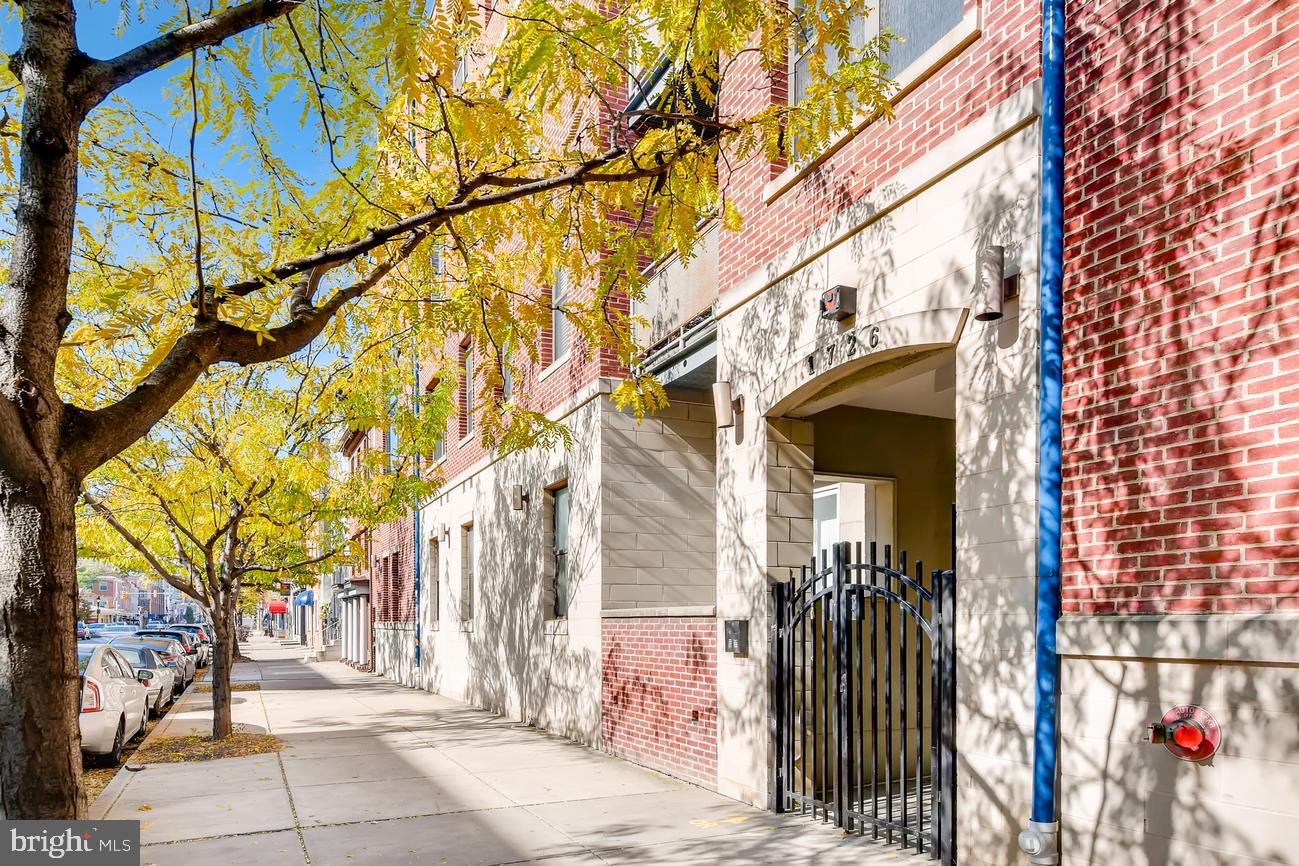 Right in the heart of Fells Point! This main level condominium boast lofty windows, high ceilings, light filled interiors, and design-inspired features throughout! Enjoy the modern kitchen with updated stainless steel appliances, ample cabinetry and breakfast bar. The dining room opens into the family room with space for a desk.The primary bedroom offers luxury finishes, a huge closet, a spacious en-suite bathroom with ample counter and storage space. The second bedroom is spacious, with courtyard views. The unit is completed with a second full bathroom and in-unit laundry with additional storage. Entertain indoors and out with the spacious living room that leads out to a private patio. Unit offers one covered garage parking spot. Incredible building with a gated community courtyard complete with grilling area, seating, Koi pond, elevator and secured covered parking garage. Walk to the waterfront, the newly renovated Broadway Market, dozens of bars and restaurants and shops!