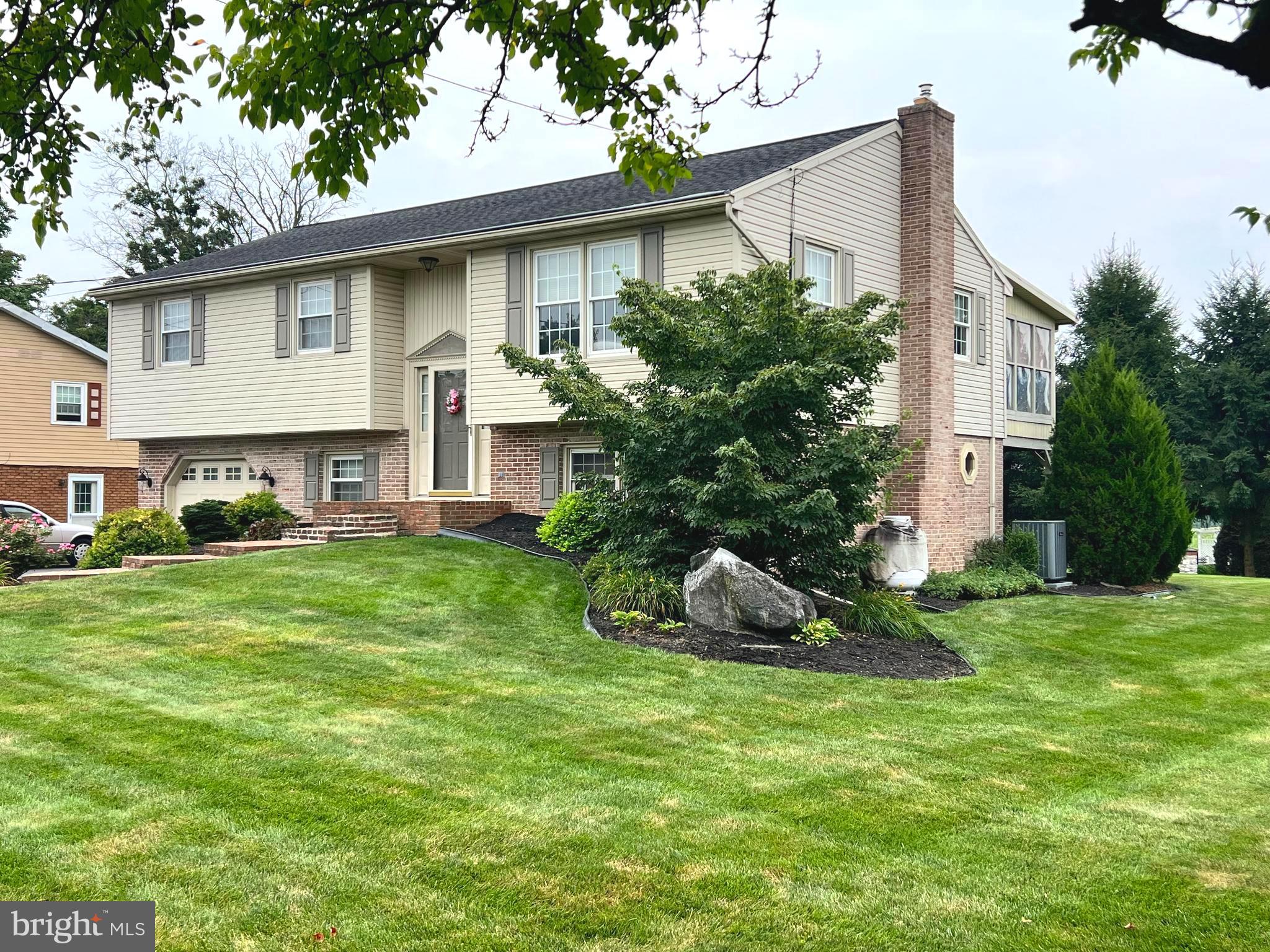This property will be offered at Public Auction on Thursday, September 18, 2025 @ 6pm. The listing price is the opening bid only and in no way reflects the final sale price. 10% down due at auction, 2% transfer tax to be paid by the purchaser, real estate taxes prorated. This bi-level home, nestled in a rural
Neighborhood surrounded by farmland, offers convenient access to Routes 283 and 230. The upper level of the home offers a comfortable family room, an eat-in kitchen with stainless steel appliances, and a dining room that opens to a spacious screened-in porch—perfect for relaxing or entertaining. This floor also includes three bedrooms and a full bathroom. The lower floor hosts a large family room with a brick fireplace, a versatile space currently being used as an in-house beauty salon, as well as a full bathroom.
Additional amenities include an attached 1-car garage, a spacious backyard with a storage shed as well as replacement windows, a water filter system for the whole house, and a newer roof. This is a great family home opportunity in the Donegal School District!