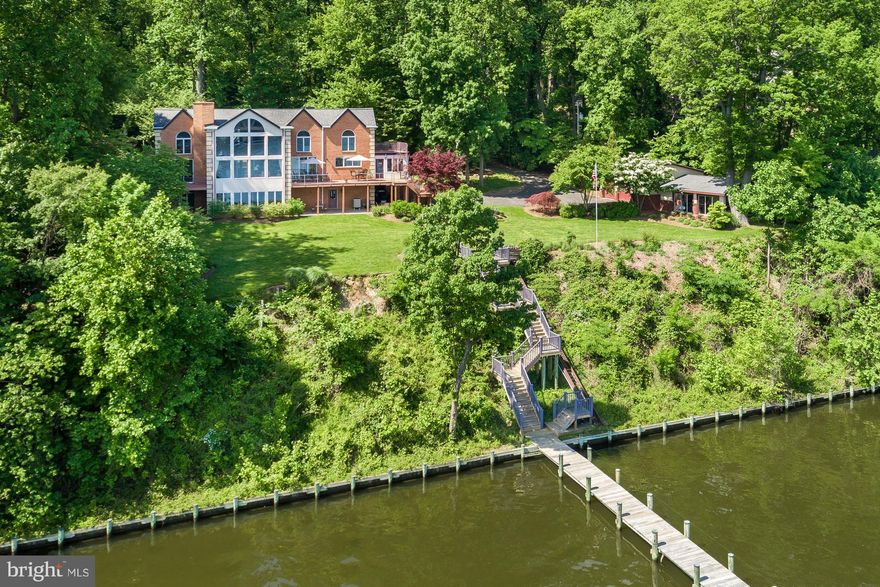 NEW PRICE!! Spectacular Severn River Waterfront home situated on 5 acres, only minutes from City Dock. Private and elegant, this property offers beautiful living spaces, multiple decks, 300' of waterfront, private pier, waterside fire pit, and panoramic views of the Severn. Five BR/ 4.5 BA; Gourmet Kitchen; Waterside office w/gas fp; Spacious Family Room, LL Bar, 4 garage parking spaces.