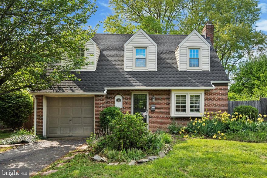 Welcome to this lovely  Cape Cod residence, gracefully situated on a serene street in Oreland. As you arrive, the lawn beckons you toward the sweet entrance. Upon entering, you'll be greeted by a cozy living room, adorned with gleaming hardwood floors and a charming wood-burning fireplace. The spacious dining room is fills with natural light and overlooks the garden. The kitchen features rich oak cabinetry, sleek stainless steel appliances, and elegant tile flooring, all enhanced by a delightful breakfast nook ideal for casual dining. Adjacent to the kitchen, a convenient utility room offers a sink and laundry facilities, along with a tastefully designed powder room.

The rear garden is a private oasis, enclosed by fencing, and showcases a spacious covered patio and a tranquil outdoor living area, perfect for relaxation or entertaining guests. The second floor presents three well-balanced  bedrooms and an updated marble hall bathroom. Recent enhancements include a new roof and gutters, replacement windows throughout, and updated heating and water systems. Central air conditioning and an attached single-car garage further enhance the comfort and convenience of this inviting home.

Ideally located, the property is within easy reach of Springfield Township schools, local shopping, the train station, and the 309 expressway. This home is in  move-in condition. Schedule your viewing today to make this home yours..