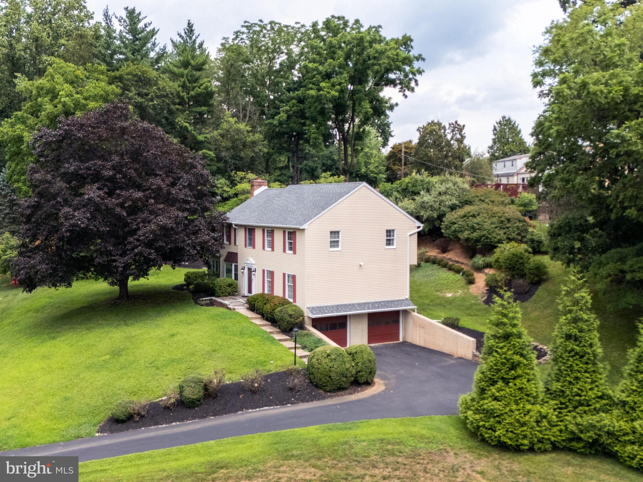 Nestled within the charming and sought after Newtown Woods cul-de-sac neighborhood, this 4 bedroom/2.5 bath center hall colonial sits regally on its lot allowing for views of sunsets from the front yard. Main floor has this traditional rooms: Family Room with fireplace, formal living room, dining room, eat in kitchen. Plus, a beautiful heated Sun Room and ease of laundry add to the main floor attraction. Off of the Sun Room is the partially wrap around deck that with one step down leads to the rear and side yard. Much of the house boasts beautiful hardwood flooring. Upstairs is the primary bedroom suite offering walk in closet, linen and full bathroom along with 3 good sized bedrooms with hall bathroom. Lower level is mostly finished space which can be used as office, play room or media room with access to the 2 car attached garage. The cul-de-sac location ensures a peaceful, safe haven with minimal traffic, while the yard offers a private retreat for outdoor enjoyment. NEWER: Heating/Cooling 2022; Driveway 2021; Roof 2019. Conveniently located to Route 3 and 252 this home allows easy access to the local Ellis Preserve Whole Foods, Newtown Township Library, Sports Fields, Giant, Acme, PJ Whelihans, numerous daycares, Ellis Preserve shopping, Ridley Creek State Park, and so much more. Enjoy the many fabulous new and or existing restaurants and shoppes Newtown Square has to offer. Centered between the Main Line, Media, and West Chester. Schedule your showing today!