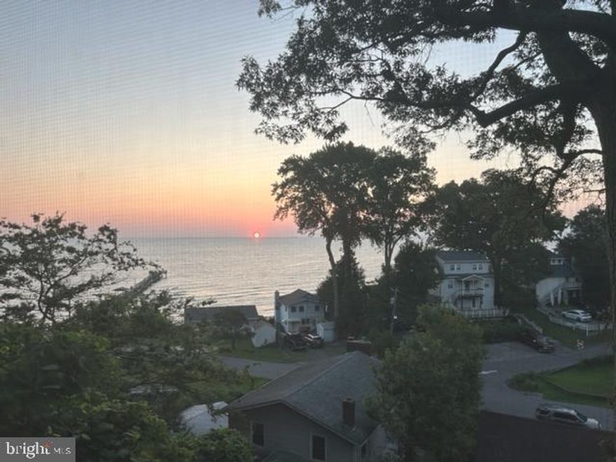 Located in the bayfront community of Kenwood Beach, this beach cottage has beautiful views of the Chesapeake Bay from the entire back of the home.   Built in 1982, the home has 2 bedrooms and a full bath on the main level.   The kitchen opens to a screened porch on an elevated deck.  

A spiral staircase leads to the finished basement which includes a large family room with a pellet stove and sliding doors to a covered patio. A  full bath, bonus room and full size laundry with washer and dryer complete the basement level.   

The lower level was previously used as an apartment with separate access, electrical panel and hookups available for a second kitchen.

Kenwood Beach includes community access to the beach and pier (pier use requires additional yearly fee to voluntary HOA)

This property is in need of some updating and cosmetic work.  The list price of $260,000 reflects the need for these updates.  The home is being sold strictly "As Is".  

Don't miss the opportunity to own this water privileged home with spectacular views!