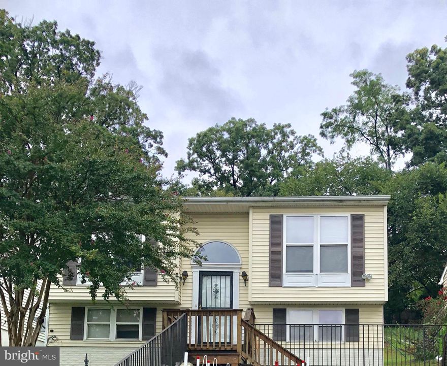 Beautiful detached split foyer w/ 4 large bedrooms & 2 full bathrooms. Cozy living room. Spacious open kitchen & dining room which leads to the nice deck & huge backyard. Basement is fully finished & has rec room, bar area, two bedrooms & full bathroom. Convenient location close to metro, shopping &  beltway. Two car driveway