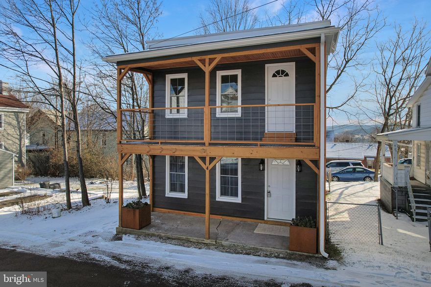 Completely Remodeled & Move-In Ready in the Heart of Frostburg! Step into modern comfort with this beautifully updated 3-bedroom, 1.5-bath home—perfectly designed for easy living and minimal maintenance.  Every detail has been thoughtfully refreshed, giving you the style you want and the convenience you need. Enjoy an open floor plan enhanced by new laminate plank flooring, a bright and welcoming kitchen with granite countertops, and appliances that convey—making move-in seamless. The main-level laundry adds everyday ease, while the mini-split systems provide efficient heating and cooling year-round.  Relax on the charming front porch, or retreat to the upper-level front balcony—a perfect spot for morning coffee or evening views. With on-street and off-street parking, you’ll always have space waiting for you.  The home also features a rubber roof, an unfinished basement ideal for storage, and a low-maintenance yard, leaving you more time to enjoy everything Frostburg has to offer.  Located just minutes from Downtown Frostburg, restaurants, shopping, Frostburg State University, and major commuter routes—this home blends convenience, comfort, and affordability in one incredible package.  Don’t miss your chance—this remodeled gem is truly move-in ready. From the moment you walk through the door, the updates, charm, and thoughtful details deliver that undeniable wow factor every buyer hopes to find. Call today to schedule your tour!