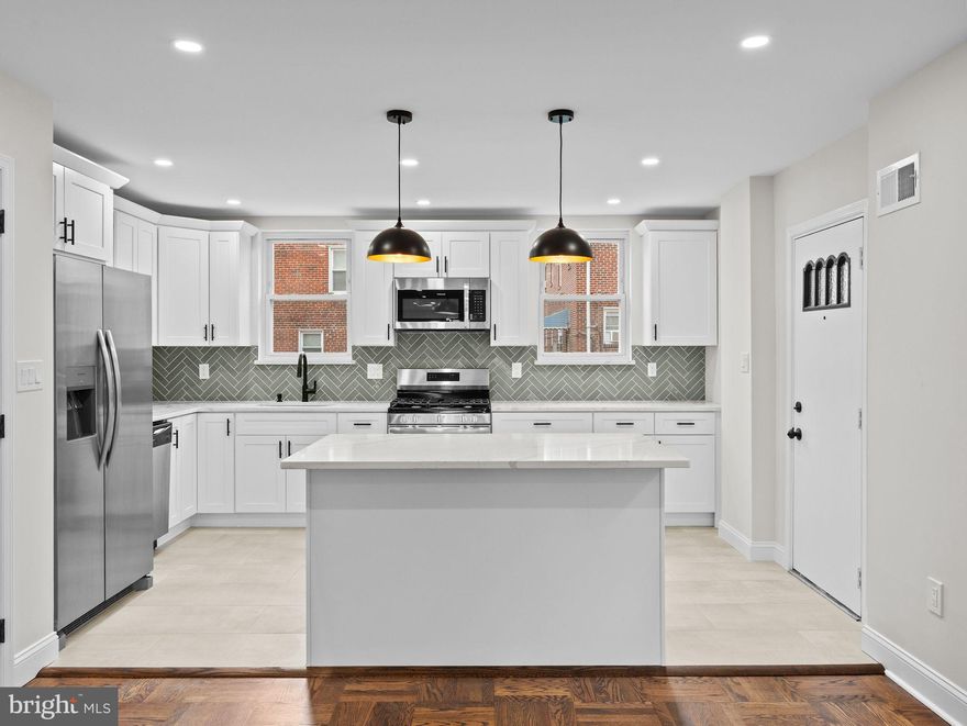 Welcome to 1007 E Dorset Street, a beautifully updated stone-front twin in the desirable Mt. Airy section of Philadelphia. This 3-bedroom, 2.5-bath home offers modern style blended with timeless charm.
Step inside to discover refinished hardwood floors, recessed lighting, and a completely open-concept living and dining area, perfect for entertaining or everyday living. The brand-new chef’s kitchen is the heart of the home, showcasing quartz countertops, a large island, custom herringbone tile backsplash, stainless steel appliances, and sleek pendant lighting.
Upstairs, you’ll find three spacious bedrooms with hardwood floors, ceiling fans, and ample closet space. The bathrooms are fully renovated with designer finishes; including a stylish hall bath with skylight and soaking tub, plus a modern en-suite with tiled shower.
The fully finished basement expands your living space, featuring plush new carpet, recessed lighting, a half bath, laundry area, and access to the garage. Ideal for a media room, playroom, or home gym.
Enjoy the outdoors with a private rear patio and driveway parking with an attached garage. This move-in ready home delivers the comfort of modern upgrades in a convenient location close to schools, shopping, transportation, and parks.
Don’t miss the opportunity to make this turnkey property yours.  Schedule a showing today!