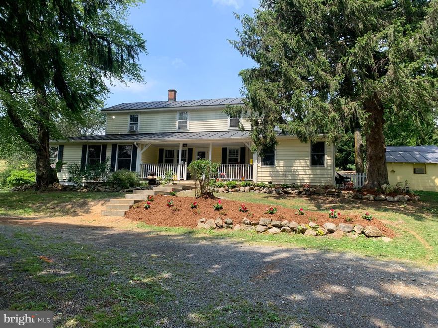 Charming 5 Bedroom and 5 Bath Farmhouse on 14+ beautiful acres! This home has been renovated and expanded and was formerly a Bed and Breakfast and Farm to Table café.  Brand New HVAC !!The property is fully fenced with two barns, seven pasture areas, a detached garage, shed, greenhouse, and root cellar. Located on well traveled state road 259 in popular Lost River Valley and stunning views!