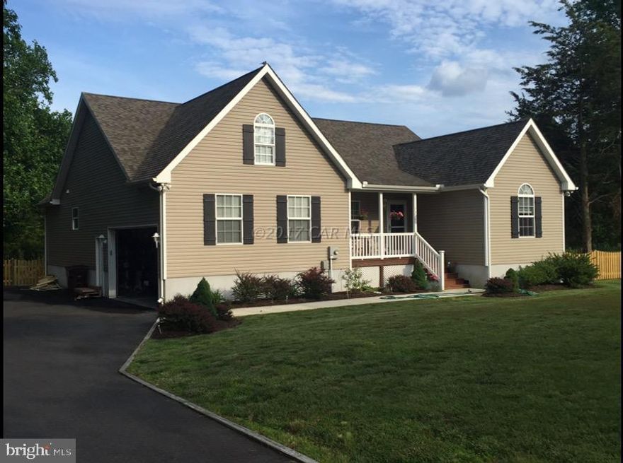 Don't let this beautiful home slip away! This 3 bedroom two full bath home is priced to sell. This home has so much to offer including an additional upstairs living room that can be used as a 4th bedroom,  an additional front office area, large 2 car garage, deck and nice sunroom overlooking the woods.  Enjoy those cookouts or campfires as you watch the deer in the distance of your back yard.