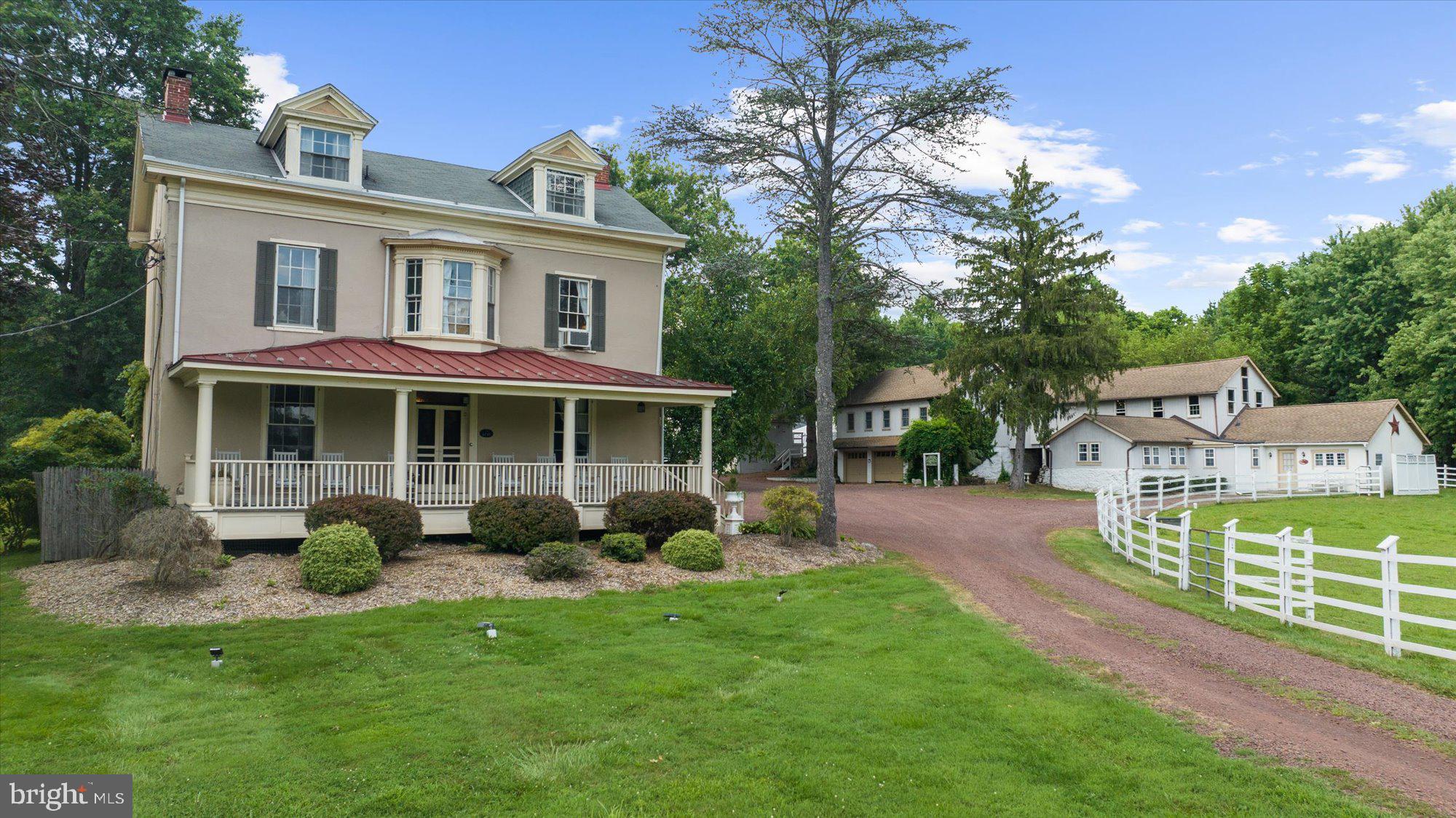 This estate is a timeless Bucks County treasure, thoughtfully renewed and steeped in both history and hospitality. Situated on just over 10 pastoral acres in the heart of Buckingham Township, this circa 1800 stucco-over-stone manor has been masterfully revitalized and now stands as one of the region’s most admired bed-and-breakfast and event properties. Inside the main residence, original character shines through hand-painted murals, wide-plank pine floors, soaring ceilings, and a sweeping staircase. The home offers five serene guest suites with private baths, as well as an inviting and well-appointed innkeeper’s quarters.
The farm’s scenic grounds are home to resident sheep and are enhanced by more than 4,200 square feet of additional structures, including two private guest cottages, the innkeeper’s residence, and a versatile event and conference barn - each upgraded with care and intention. The property’s refined charm and welcoming atmosphere have made it a sought-after venue for intimate weddings, executive retreats, and weekend escapes.
Whether you're envisioning a fully turnkey hospitality business or a private country estate with space to gather and host, this is a rare opportunity. This is not a property in waiting, it's purposeful and poised for its next chapter. Zoning supports additional commercial uses; please inquire for details.