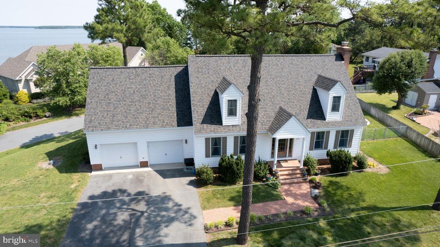 Cambridge - exceptional Cape Cod offering water views and water rights!  Don't miss this 3 BR, 3 1/2 bath home located in the Algonquin area .  Attention to detail is evident through out, Built  by one of the areas most meticulous builders, the quality of construction is some of the best !  You are going to love the first floor porch and second floor deck offering some of the prettiest sunsets around. Granite  counters and custom cabinets in the eat in kitchen, beautiful dining room, and living room with true masonry fireplace (currently gas logs but can be used for wood burning) Large primary bedroom and bath featuring your own jetted tub, and double vanities.  Convenient laundry on the second floor.  Attached two car garage. Brand new 50 year shingle roof.
The backyard is fenced and offers an in ground pool for summer fun.  Large, elevated corner lot.