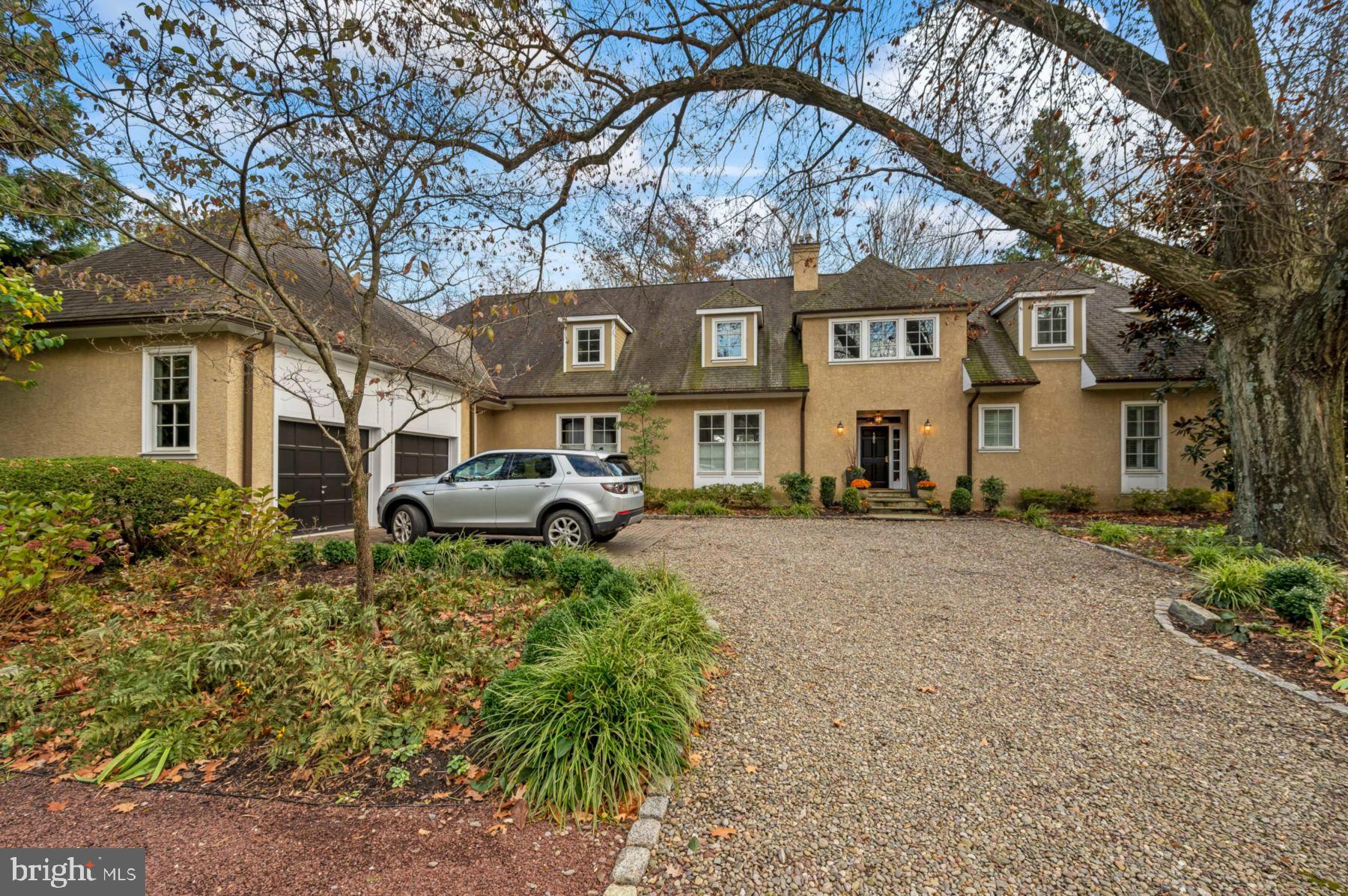 We are proud to present this light filled custom home set on over half an acre in Chestnut Hill. Enter through a welcoming entry hall to a fantastic first floor plan perfect for modern living and entertaining. To the right of the entry hall is a fabulous first floor primary suite with an entire wall of built-ins and closets for excellent storage and an en suite bath with a huge walk in shower. To the left of the entry hall is the formal living room with fireplace and large dining room with multiple glass French doors that lead to the back deck that flanks the entire back of the home. Amazing gourmet kitchen with huge island, desk area, and large pantry that is open to a family room space that could also be used as a breakfast room. Two powder rooms and a mudroom with built in cubbies and indoor access to the attached two car garage completes the first floor. Two staircases lead to the second floor with an additional three bedrooms, two full hall baths and a cozy sitting room with a fireplace. All of the bedrooms have large closets and there are multiple storage areas. The basement has been finished with an entertainment room which includes a built in TV console, a full bar and a large wine refrigerator. The separate exercise room and a full bathroom with a steam shower makes for an extra getaway on a rainy day. Enjoy the seasons on the back deck with the mature landscaping, or walk to the Park or train for convenient access to Center City or beyond.
1. Taxes: Sellers have a Homestead Exemption of $85,000 for a payment due of $20,366 at 1.3998% of net assessed value.
2. Property includes a radon system, sump pump and new tankless water heater and irrigation system.
3. Property is hard-wired for a home security system that is not currently activated. Sellers installed a wireless system of security cameras which is integrated with smoke detectors and CO2 detectors which are controlled through the smart Google Nest Home app.