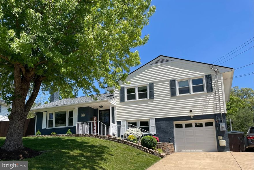 Welcome to this charming 3-bedroom, 2-bathroom home nestled in a friendly neighborhood, conveniently located near shopping, the NEW Whole Foods & Trader Joe's,  dining, parks, public transportation, the metro, and highways. Enjoy family time in the spacious open floor plan dining/living area, highlighted by a shiplap accent wall. The updated kitchen features granite countertops, stainless steel appliances, and ample cabinet storage. The main bathroom on the upper level boasts marble tile flooring. The sunny basement family room, with porcelain flooring and a full bath, is perfect for watching the game with friends. Store your seasonal items in one of the two sheds; one has been converted into an office space with flooring, built-in cabinets, a portable AC, and a heater. Parking is easy with an extra-wide driveway that accommodates up to 4 cars. Let the kids play outside in the huge fenced backyard, which includes a large patio for entertaining and a fun playset!   This home wont last long!