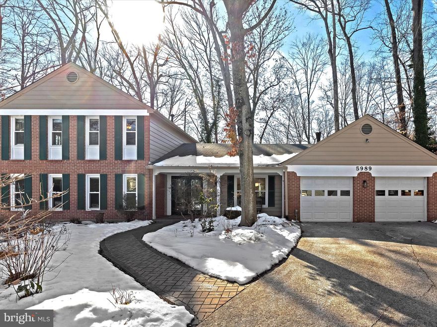 Tucked away on a peaceful cul-de-sac, this beautifully updated home offers a perfect balance of charm, comfort, and modern convenience in the heart of Columbia. Just minutes from the vibrant Merriweather District, Whole Foods, Columbia Mall, and major travel routes, this residence is ideally situated for both everyday ease and weekend entertainment. A welcoming covered front porch sets the tone for the inviting spaces inside. Hardwood floors flow through the formal living and dining rooms, both accented with classic chair rail molding. The updated kitchen features 42-inch cabinetry with undermount lighting, gleaming granite countertops, and stainless steel appliances, including a gas range. A pantry provides extra storage, while the sunlit breakfast area, framed by a picture window, is the perfect spot to start the day. Just beyond, the cozy family room is a true focal point, showcasing a striking brick accent wall with an arched wood-burning fireplace. A sliding glass doors opens to the rear patio, seamlessly connecting indoor and outdoor living. A built-in bookcase nook off the family room offers an ideal space for remote work or homework, while a convenient laundry room and powder room complete the main level. Upstairs, the serene primary suite boasts a walk-in closet and an en-suite bath with a tiled shower and glass enclosure. Three additional well-appointed bedrooms share a sleekly updated full bath featuring a subway-tiled tub/shower surround. The lower level provides even more living space, with a versatile recreation room ready for movie nights, hobbies or a home gym. A spacious storage room ensures ample space for organization. Outside, the rear patio overlooks a lush backyard framed by mature trees, offering a peaceful escape. As a Certified Wildlife Habitat, this outdoor retreat attracts birds and wildlife, creating a tranquil natural setting. With fresh paint throughout, recessed lighting, replacement windows that bathe the home in natural light, updated HVAC, and newer flooring, this move-in-ready home is a rare gem in one of Columbia’s most desirable locations.  Please note: photos depicting furniture utilized virtual staging. Located in Columbia Village of Oakland Mills. CPRA Tax is:  $1,353