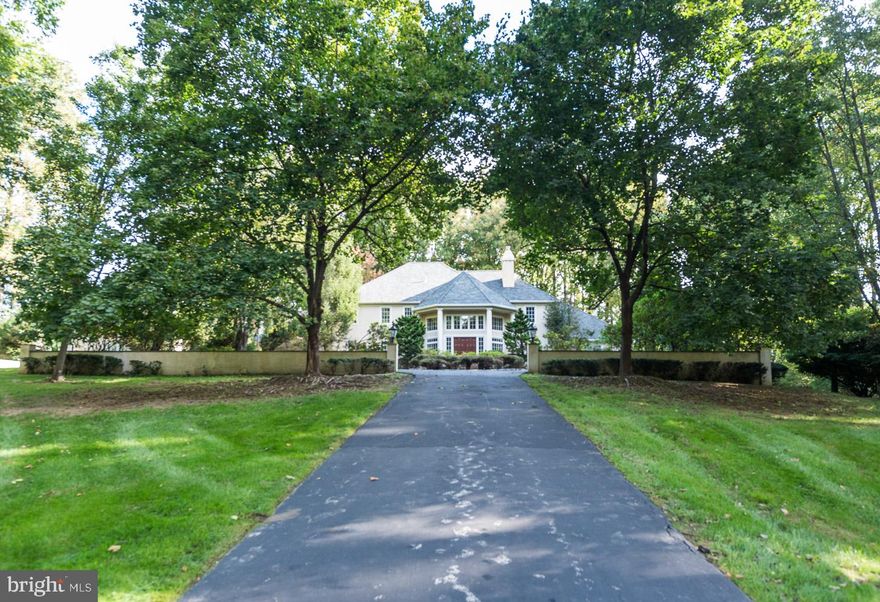 Welcome to this stately home on over 4 acres of beautiful land in the heart of Radnor Hunt. The pride of ownership and the proof of a lovingly maintained home by the original owners is prominent throughout this grand and inviting property. As you approach this magnificent home, you will immediately recognize the grandeur of the property. A circular drive leads to the attached, oversized 4-Car garage. Upon entering this home, a dramatic and impressive 2- story marble foyer greets you with columns, sparkling chandelier, sweeping curved staircase and beautiful bridge linking the upper level rooms. Step down into the formal 2 story Living Room, flooded with natural light from 2 stories of windows, gorgeous hardwood floors, a wood burning fireplace, and a sparkling chandelier in the center of it all. Continuing through this storybook home, is the formal dining room with classic swing-door access into the massive kitchen, a cook's delight and the perfect centerpiece for gatherings. With a center island, recessed lighting, custom built-in wine rack, undermount lighting, roll out drawers, double ovens, double cooktops, and an additional eating/sitting area, you will not find a more generously appointed kitchen. Directly off the kitchen is access to the gorgeous fully screened-in porch with vaulted ceiling and skylight. Step down into the warm and inviting Family Room with floor-to-ceiling stone fireplace, custom built-in bookcases with undermount lighting and French doors leading to the deck, perfect for indoor/outdoor living and dining. This home features a luxurious first-floor Master Bedroom with Tray ceiling and a private Library with custom built-ins on either side of a fireplace through pocket doors. This Master Bathroom is stunning with marble floors, vaulted ceiling with skylights, raised jacuzzi tub, double vanities with granite counters, and a steam shower. The first floor of this home also offers a large laundry room and 2 powder rooms. Up the grand staircase, you'll find 3 spacious bedrooms, each with its own en-suite bathroom. On this expansive property, you'll find an in-ground pool surrounded by impeccably maintained grounds. As you would expect, a home like this also includes countless highlights such as an advanced security system, central vacuum, 3 heating zones, intercom and Bluetooth music distribution system throughout the home, cedar closet, custom moldings and much more. Be sure to view the floorplans, virtual tour, and schedule a showing today! Please submit offers by Monday April 29th at 4pm.  Sellers reserves right to accept any offer prior to April 29th.