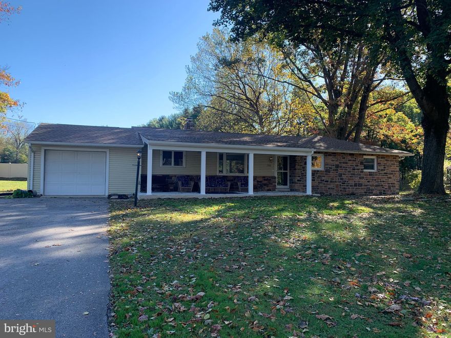 NEW, NEW and NEW!!! Roof, front porch, stone front of home, pantry in kitchen, kitchen painted, windows and sliding glass door in Sun room, Sun room painted, fireplace in living room opened up, 1/2 bath in hallway converted to full bath, main bathroom now part of main bedroom suite and more....All new in 2025!! Basement has been sealed and painted. As close to the Carlisle Borough as you can get without being in it. Easy road access. A must see!!