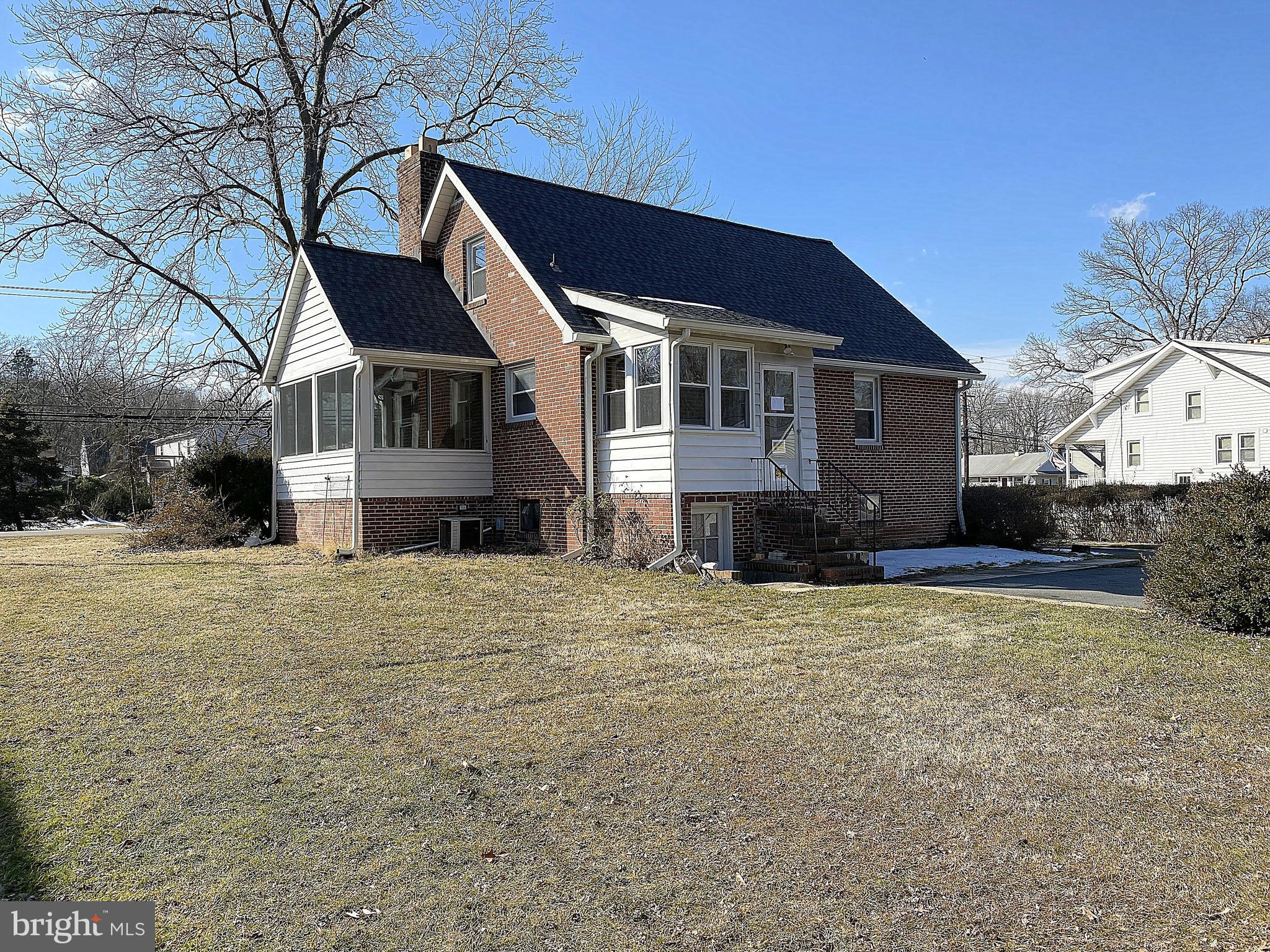 Coming Soon - Expected on Market Date 2/5/2021 - Professional Pics Coming Soon. EDGEMERE - Retro is back with this 3 bedroom, 1.5 bath brick bungalow. This home has so much to offer with its charm and character. The main level has it all including a fresh coat of paint, wood flooring, built in china cabinet, wood fireplace, almost new windows, sun porch, breakfast porch, 2 bedrooms and a full bathroom. The upper level is one large bedroom with knotty pine walls and super cute built in beds. The lower level has plenty of room for storage and has a half bath but you could also build it out for additional living space. Mostly newer windows and a nearly new roof. Extra large yard with a 2 car garage and several spaces for parking in the driveway. Sold AS-IS but at this price, there is a lot of room to add your personal touches.
