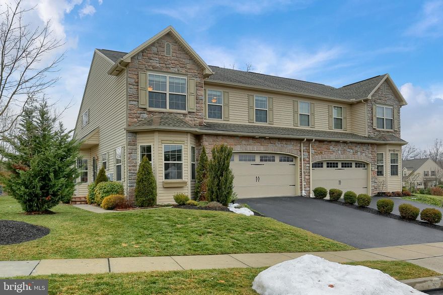 This unique townhome located within Village at North Ridge is waiting for its new owner.  The features of this home are floor to ceiling stone fireplace, vaulted/cathedral ceilings, wood and tile flooring, 1st floor primary bedroom and laundry room, 2 car garage,  LL  craft room/office, 2nd floor media/family room which opens to the first floor, private rear yard with brick patio and great storage.  Come take a look for yourself.  Schedule a showing today!