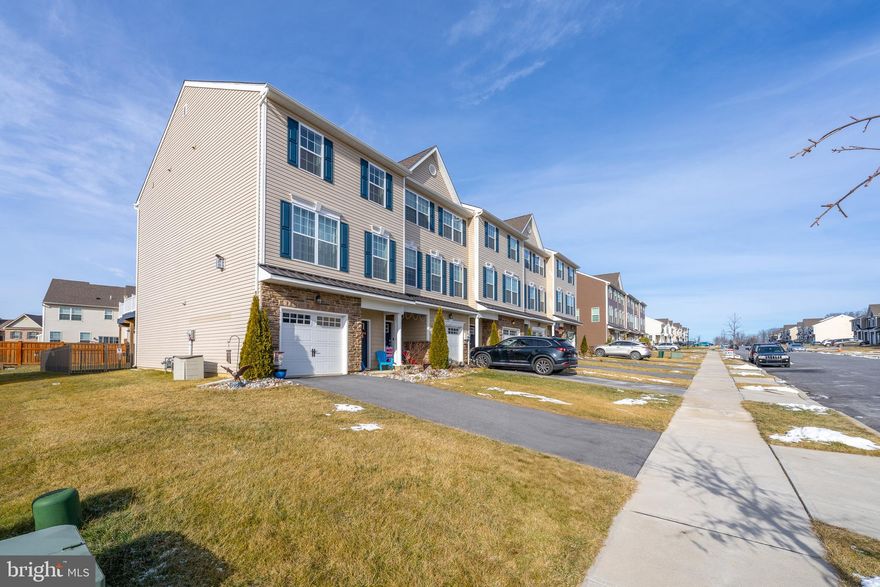 Experience luxurious living in this desirable end-unit townhouse within the esteemed Parkland School District. A newer construction at only 3.5 years old, The Kay Builders Washington model offers 2,260 square feet of refined living space. Boasting three generously sized bedrooms and 2.5 bathrooms.  The kitchen showcases a center island, ideal for gatherings or casual dining. Complete with 42" cabinetry, granite countertops, and stainless steel appliances, it combines functionality with sophistication. The master suite provides a tranquil sanctuary, with a walk-in closet. Out back you can enjoy the 10x12 Trex deck and private fenced in yard.  Become a part of the thriving Blue Barn community and benefit from a low HOA fee and convenient location, close to Route 22 and I-78 perfect for commuting. Don't let this opportunity slip away to make this exceptional property your new home, where luxury merges with convenience.