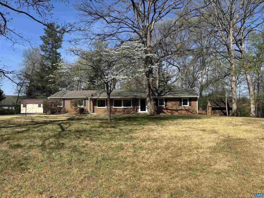 Enjoy one level living in this recently renovated and spacious brick rancher. Just minutes off of 29, this property offers a combination of quiet and convenience. Perfectly situated on a large one acre lot, this house is move in ready and beckons it's new owners. Recent improvements include all new LVP flooring and paint throughout, new stainless appliances and quartz tops on solid wood cabinets, new shower vanities, toilets in bathrooms, new HVAC, landscaping and lot improvements, and much more. Extra storage in sheds that convey as-is. Only 25 minutes to Charlottesville and UVA, minutes to NGIC, 15 minutes to the airport. Come see it today!