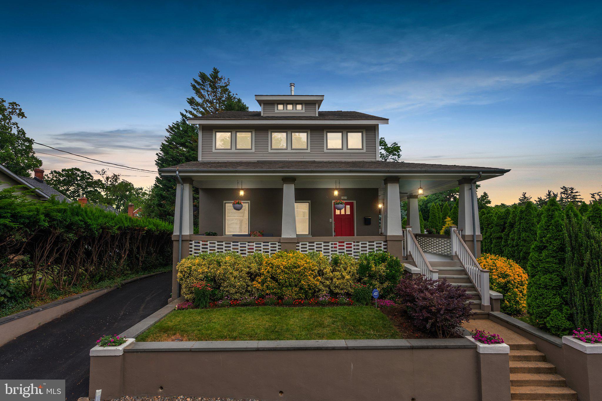 This one-of-a-kind 1916 Craftsman home is situated on a lushly landscaped quarter acre adjacent to Koiner Farm in the heart of downtown Silver Spring (protected from development for posterity). From its elevated perch, the home exudes vintage charm and has been thoroughly renovated to create gorgeous and thoughtful living spaces. Exacting attention has been paid to every detail and finish. The classic wrap-around porch, with its haint blue beadboard ceiling, period-appropriate lighting and ceiling fan, is just one of several awesome outdoor living spaces.
The graciousness of this home is immediately apparent. Its richly-stained rift and quarter sawn white oak flooring offsets 9’ high ceilings on the main and upper levels, providing airy rooms accented by handsome trim, five-panel doors, fabulous lighting fixtures, custom window treatments and other superb architectural features. It is a work of art. Defined rooms flow effortlessly into one another to capture an open feel while retaining warm, livable spaces. Enter the living room with custom lighting and wood-burning fireplace. A grand cased opening leads to a family room with a door to the wrap-around porch; an elegant dining room with built-in bar and an antique glass-front Shaker corner cabinet, an exquisite crystal bead chandelier; and, a truly extraordinary gourmet kitchen with windows galore, a stainless steel GE Cafe appliance package, a wine cooler and an elegant glass tile backsplash. Providing seating for 7 and loads of prep space, the elongated center and additional peninsula island with pendant lighting feature rich Stromboli granite countertops with magnificent movement and veining. Custom cabinetry with soft close drawers provides tons of storage. The kitchen opens to the back porch, another covered outdoor space. The main level also includes a bedroom/office, a full bathroom with claw-foot tub/shower and a richly-textured accent wall, as well as a first-floor laundry closet.
A stunning staircase leads to the bright and sunny landing - not just a hallway. It features a reading nook overlooking the stairs and plentiful wall space for displaying art gallery-style. On this level, there are three generously-sized bedrooms and three full bathrooms, two ensuite. The front bedroom, with exceptional natural light, includes a transom window facing a lighted 14-foot-high vaulted ceiling in one area. The primary bedroom suite has a perfect bathroom with two marble-topped vanities and a glass-enclosed shower, a huge walk-through closet outfitted for easy and elegant organization, custom floating display shelving and an additional wall closet.
The lower level, accessible via another amazing stairway, provides a newly remodeled suite featuring a gorgeous prep kitchen with quartz and granite countertops, designer backsplash and plenty of custom cabinetry and built-in seating. There is also a spacious family room, a private bedroom with a large at-grade window overlooking the bluestone patio, a bathroom, a second laundry room, and a separate entrance/mudroom with custom built-ins. This level provides additional living areas, private space for guests, and the option for income as a short-term rental or an ADU.
The stately grounds of this home are integrally connected to the home through the porch areas leading to the gorgeous patio and curved stone seating wall. The large yard areas have colorful plantings and mature trees. The side yard is defined by a row of beautiful arborvitae, providing a “green fence” and a sense of grandeur. Enter via the private and newly-paved side driveway to find plenty of parking in back.
With a Walkscore of 96 out of 100, you can buy fresh fruit, veggies and honey from Koiner Farm, shop at Whole Foods or nearby Safeway, go to Downtown Silver Spring, or walk to Metro - all just blocks away.