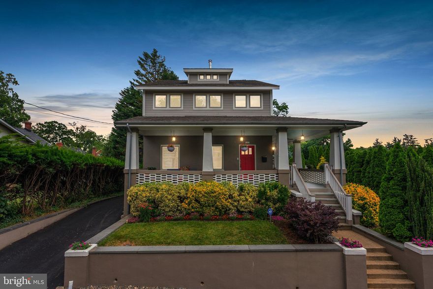 This one-of-a-kind 1916 Craftsman home is situated on a lushly landscaped quarter acre adjacent to Koiner Farm in the heart of downtown Silver Spring (protected from development for posterity).  From its elevated perch, the home exudes vintage charm and has been thoroughly renovated to create gorgeous and thoughtful living spaces.  Exacting attention has been paid to every detail and finish.  The classic wrap-around porch, with its haint blue beadboard ceiling, period-appropriate lighting and ceiling fan, is just one of several awesome outdoor living spaces.

The graciousness of this home is immediately apparent.  Its richly-stained rift and quarter sawn white oak flooring offsets 9’ high ceilings on the main and upper levels, providing airy rooms accented by handsome trim, five-panel doors, fabulous lighting fixtures, custom window treatments and other superb architectural features.  It is a work of art.  Defined rooms flow effortlessly into one another to capture an open feel while retaining warm, livable spaces.  Enter the living room with custom lighting and wood-burning fireplace.  A grand cased opening leads to a family room with a door to the wrap-around porch; an elegant dining room with built-in bar and an antique glass-front Shaker corner cabinet, an exquisite crystal bead chandelier; and, a truly extraordinary gourmet kitchen with windows galore, a stainless steel GE Cafe appliance package, a wine cooler and an elegant glass tile backsplash.  Providing seating for 7 and loads of prep space, the elongated center and additional peninsula island with pendant lighting feature rich Stromboli granite countertops with magnificent movement and veining.  Custom cabinetry with soft close drawers provides tons of storage.  The kitchen opens to the back porch, another covered outdoor space. The main level also includes a bedroom/office, a full bathroom with claw-foot tub/shower and a richly-textured accent wall, as well as a first-floor laundry closet. 

A stunning staircase leads to the bright and sunny landing - not just a hallway.  It features a reading nook overlooking the stairs and plentiful wall space for displaying art gallery-style. On this level, there are three generously-sized bedrooms and three full bathrooms, two ensuite. The front bedroom, with exceptional natural light, includes a transom window facing a lighted 14-foot-high vaulted ceiling in one area.  The primary bedroom suite has a perfect bathroom with two marble-topped vanities and a glass-enclosed shower, a huge walk-through closet outfitted for easy and elegant organization, custom floating display shelving and an additional wall closet. 

The lower level, accessible via another amazing stairway, provides a newly remodeled suite featuring a gorgeous prep kitchen with quartz and granite countertops, designer backsplash and plenty of custom cabinetry and built-in seating. There is also a spacious family room, a private bedroom with a large at-grade window overlooking the bluestone patio, a bathroom, a second laundry room, and a separate entrance/mudroom with custom built-ins.  This level provides additional living areas, private space for guests, and the option for income as a short-term rental or an ADU.

The stately grounds of this home are integrally connected to the home through the porch areas leading to the gorgeous patio and curved stone seating wall.  The large yard areas have colorful plantings and mature trees.  The side yard is defined by a row of beautiful arborvitae, providing a “green fence” and a sense of grandeur.  Enter via the private and newly-paved side driveway to find plenty of parking in back. 

With a Walkscore of 96 out of 100, you can buy fresh fruit, veggies and honey from Koiner Farm, shop at Whole Foods or nearby Safeway, go to Downtown Silver Spring, or walk to Metro - all just blocks away.