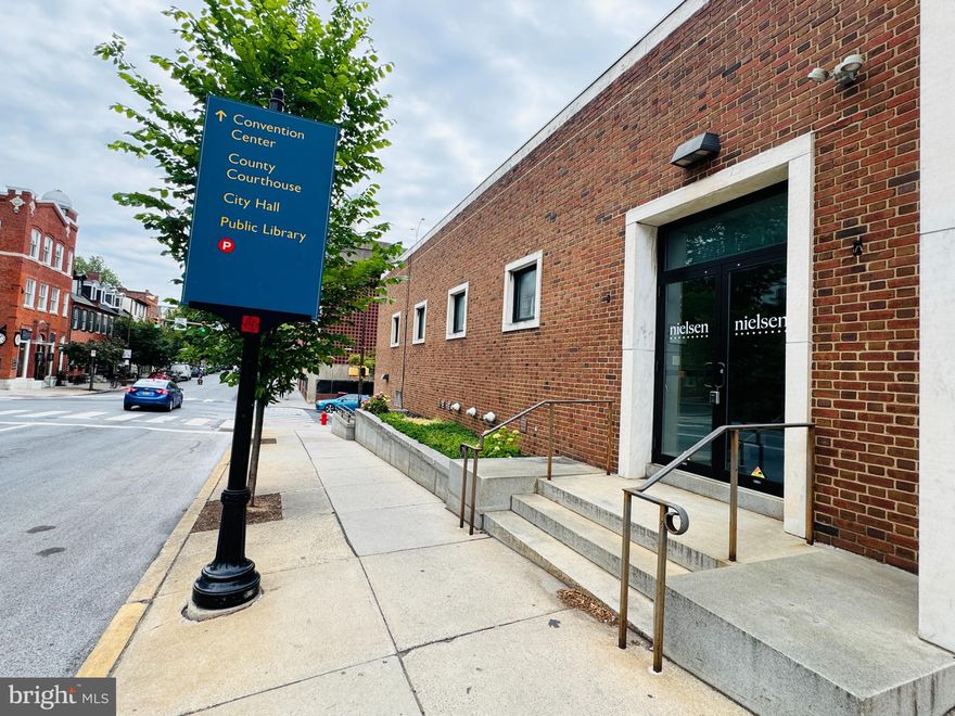 Previously occupied by the Neilsen Ratings Company, this refreshed office offers a flexible layout with several private offices, large open workspaces, conference rooms and a spacious training center featuring extendable walls to create up to three smaller training rooms. Existing furnishings, projectors, and screens are included. Features: Private break room, kitchen, private restrooms, direct glass door entry into office and an ADA-accessible entrance with elevator access to the suite. Enjoy parking in the secure lower-level garage. 12 onsite parking spaces are included in the rent. 8 Additional spaces are available for in the building for $100/month/space, plus easy street parking and 2 adjacent public garages. The suite benefits from abundant natural light through oversized windows, heavy IT/data connectivity, and is fully sprinklered. Walk Score of 99/100—just steps from Lancaster’s best cafés, restaurants, entertainment, the courthouse and city and county offices. Base rent is $14.00 PSF NNN, with 2025 estimated NNNs at $6.35 PSF.