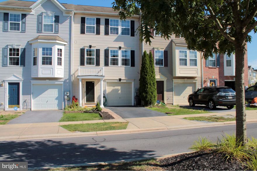 This updated townhome backs to Pangborn Park and is just steps away from the connecting trail to Fairgrounds Park.  Enjoy the views from the rear slate patio or take a stroll along stream that feeds Pangborn lake.  Park Overlook community is situated perfectly between both of these parks offering walking trails, tennis courts, basket ball courts, softball fields, picnic pavilions, horse shoe pits, bowling green, playgrounds, soccer fields, bmx track, indoor ice skating and outdoor inline hockey arena.  There's plenty to keep everyone busy with the surrounding amenities.  Step through the front door and you'll find a spacious entry foyer leading to the main level family room.  The family room offers recessed lighting, built-in dry bar, custom trim package and access to a full bath and laundry room on this level of the home.  The sliding glass doors from the family room lead to the rear yard and slate patio.  This level also offers a spacious 1-car garage, multiple storage areas, and numerous closets.  The second level offers a formal living room, eat-in kitchen and spacious family room addition.  The living room offers access to a half bath on this level.  The kitchen features a center island with breakfast bar, separate breakfast nook, all appliances, pantry, custom tile back-splash and  recessed lighting.  Open to the kitchen is the airy family room, which catches East facing morning sunlight.  This room offers sliding glass doors to your future deck.  The third level of the home features 3 bedrooms and 2 full baths.  The master-suite comes complete with cathedral ceilings, huge walk-in closet and deluxe private bath.  The master-bath offers custom tile floors, soaking tub, separate shower, and double vanity.  Located within easy access to both I-70 and I-81 this home is commuter friendly.  You'll find Pangborn elementary school within a mile of the home.  The homes location also offers quick access to 24-hour retail and grocery stores, shopping and dining options, the Greens at Hamilton Run golf course and many employment centers.