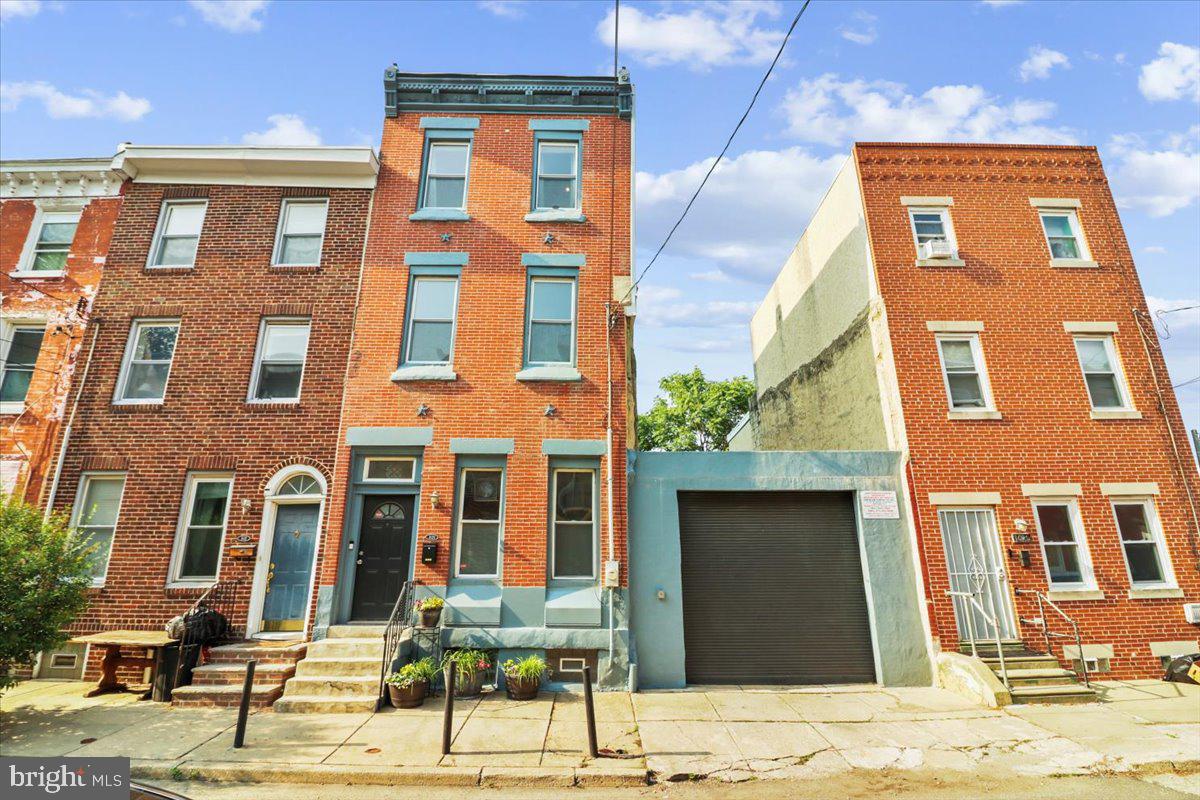 Style, space, and city living done right- welcome to 1629 W Stiles Street. This one’s not your average rowhome, it’s a 32’ wide double-parcel dream with serious perks: private parking, tons of outdoor space, and a layout that flows from top to bottom.
Let’s talk curb appeal. That classic brick façade? Total vibe. And yes- that’s your very own deeded side lot with off-street parking for two. (Or maybe a garden, fire pit, dog run...or future development? You decide.)
Step inside the foyer and feel the space. The open-concept first floor is ideal for entertaining with plenty of room for living, dining, and your favorite cozy corner. Plus, a first-floor powder room, hardwood floors, and a coat closet? Rare. Chic. Practical.
Picture hosting brunch in the sun-soaked kitchen in the back of the house with black granite countertops, stainless steel appliances, and a 5-burner stove. Open the back door to your deck with storage closet and electric and massive fenced-in side yard- a true outdoor oasis in the city.
Upstairs, on the 2nd floor, you’ll find three roomy bedrooms, a full bathroom with a soaking tub, and a new stackable washer/dryer for that everyday convenience. The back bedroom gets incredible natural light, the middle room has a perfect window nook, and the front bedroom windows overlook the quiet street- each room has its perk.
Head to the top floor for your private third-floor primary suite, complete with exposed brick, zoned heating/cooling, a private roof deck, and a luxe full bath with a standing shower. This level is perfect for relaxing, recharging, and sneaking in sunset views.
This home checks off so many boxes- the basement? Huge and dry and great for storage. Updated 200-amp electrical box with room to add an electric car charger. There's central A/C (2018), a wired security system already in place, and ring sensor security windows.
Location-wise, you're in the mix- steps from the Broad Street Line Girard stop, there are three grocery stores within a mile. Don't forget great eats + hangs at Bar Hygge, Liberty Grounds, The Met, and more. All of the major museums, City Hall, and Temple are within walking distance. The #15 trolley extends your reach from Fishtown to the Philadelphia Zoo. The Broad Street Line Subway gets you to a Phillies game within 15 minutes, and the #2 bus brings you home from shopping downtown.
Ready to claim your space in one of Philly’s most exciting neighborhoods? Francisville, meets Fairmount meets, Temple adjacent in this rare city-living package- and it’s move-in ready.
Book your private tour- this one’s got the space, the extras, and the potential.