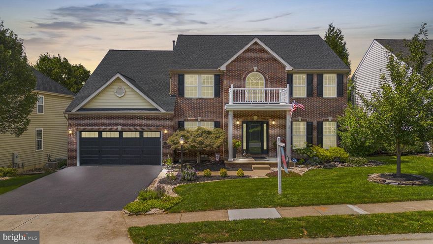 Welcome to 11086 Sanadrew Drive, a stunning gem in the highly desirable Westwinds of Lake Linganore! This home truly feels like a private retreat with its impressive updates and meticulous care. From the moment you arrive, you'll be captivated by the exceptional curb appeal, manicured grounds, and inviting hardscaping.

Step inside to a grand two-story foyer bathed in natural light, and you'll immediately notice the elegant hand-scraped hickory hardwood floors that flow throughout the main level. To the right, a private office (or potential first-floor bedroom) awaits, while to the left, a spacious living room features custom crown moldings. Columns guide you into the dining room, which boasts chair rail, crown molding, and custom wall moldings. The kitchen is a culinary dream, with 42" maple cabinets, granite countertops, recessed lighting, a custom backsplash, and ceramic tile floors. It also features a separate desk area, stainless steel appliances, a pantry with a barndoor, and a massive custom island with a microwave drawer, cooktop, extra seating, and abundant storage. The family room exudes warmth and coziness with its custom gas fireplace, hearth, and mantel, complemented by upgraded carpeting. Adjacent to the family room is the sunroom, where expansive windows and a custom arch frame a breathtaking view.  French doors lead to a spacious deck with a retractable awning, perfect for enjoying sunsets and relaxation. The thoughtfully designed laundry/mudroom includes space for folding, a laundry tub, and garage access. As you ascend upstairs take note of the updated iron stair balusters and custom carpet. The custom hickory floors extend throughout the upper hallway and into the magnificent Primary Suite. This luxurious retreat features a sitting area, vaulted ceilings, crown molding, and an extraordinary closet with custom cabinetry. The spa-like primary bath includes heated floors, a large soaking tub, dual vanities, a walk-in linen/medicine closet, and a separate shower with elegant tile work. Three additional spacious bedrooms and an updated full bath complete the upper level. 

The basement is a versatile space with LVP flooring and neutral finishes and includes a large rec room, exercise room, fifth bedroom with a walk-in closet, storage areas, and access to an impressive back patio.

The outdoor space is a true masterpiece, featuring stone retaining walls, high-end pavers, solar lights, and a custom firepit. Every detail of this home has been thoughtfully upgraded, including new light fixtures, door handles, custom window treatments,  and several barn doors have been added throughout. The interior has been freshly painted, and recent updates include 2019 and 2014 HVAC systems, a 2023 roof, a 2020 water heater, and new attic insulation.

The Lake Linganore community offers a wealth of amenities, including four swimming pools, pickleball and tennis courts, basketball courts, a private lake with beaches, and scenic hiking trails. Plus, the nearby old community golf course, which will never be developed, provides additional green space and recreational opportunities and is within walking distance of the home! 

Don't miss out on this beautifully designed home with an assumable VA loan—it's a private sanctuary with everything you could desire!