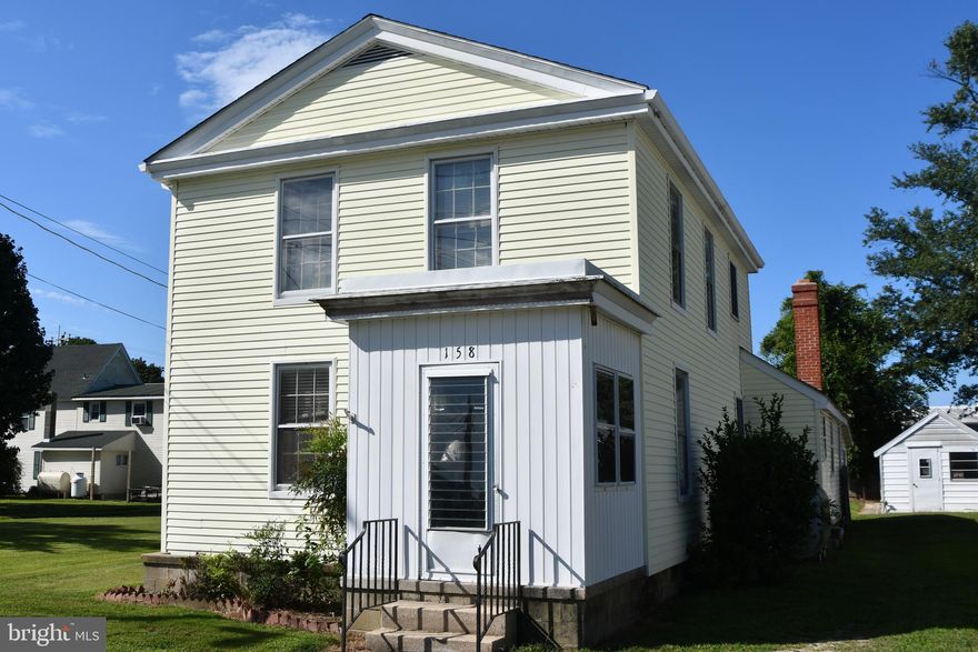Step back in time with this charming 3-bedroom, 2-bathroom home built in 1890, located in the heart of Preston. Full of character and original details, this home offers a unique opportunity to restore and customize a piece of local history. The inviting living room features a cozy fireplace, perfect for relaxing evenings. A large laundry room and a separate den/office provide flexibility and extra space for modern living.

Outside, you’ll find an oversized shop/garage ideal for hobbies, storage, or a workshop. The property also includes a home generator, adding peace of mind. While the home does need some work, it has great bones and endless potential to become a stunning residence once again. Bring your vision and breathe new life into this timeless property.