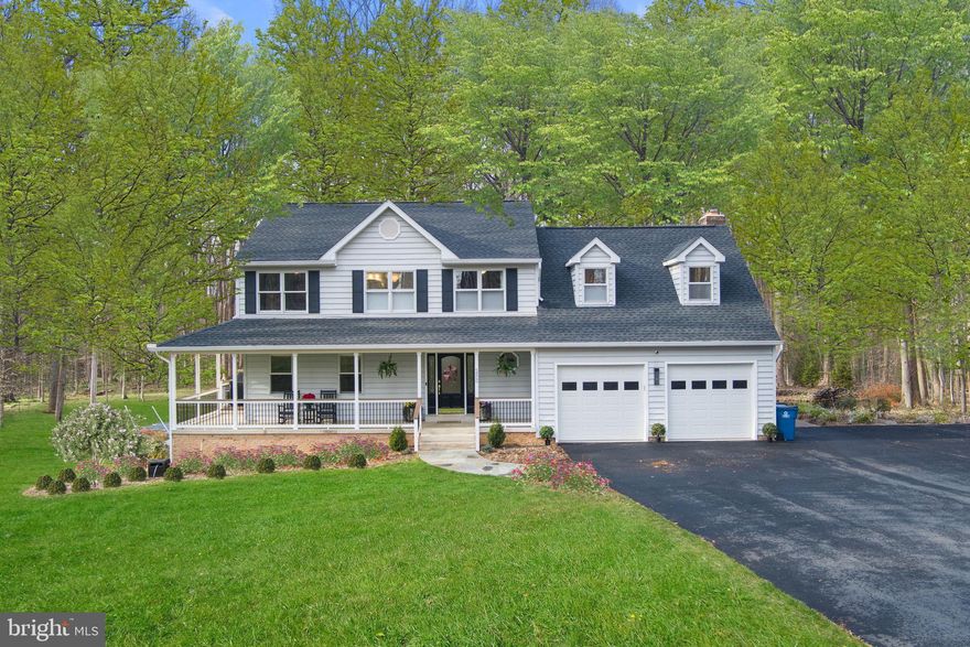 $50,000 price improvement for this unique 5-acre private retreat!   This is an exceptional opportunity to own this spectacular turn-key property.   Five fully fenced acres of level, low maintenance, private, wooded, and open areas where the pets and family can roam and play!  Four bedrooms, 3-1/2 baths, gorgeous woodlands,     Serene haven offering rare peacefulness and privacy.  The house is sited amid extensive lawns bordered by mature trees, providing complete privacy from spring to late fall.  The vistas you enjoy from most rooms and from the large deck and spacious yard are of woodlands, birds, and nature.  The grounds include perennial flowers and shrubs, a large, wood-burning fire pit, and a big burbling pond.  There’s a hot tub on the deck where you can enjoy the tranquil views. 

  There’s nothing you need to do.  Everything has been upgraded with more than $500,000 in recent improvements. .  Whether you’re looking for luxurious living, seeking a private retreat, or looking for rental income potential, you’ll find it all here.

A flagstone walkway leads to the welcoming front porch and handsome entry door with sidelights.  The main level has an open floor plan with amazing natural light from walls of windows overlooking the views.  There’s a private study or home office just off the foyer, and a powder room tucked away from the cooking and dining area.  The kitchen, dining, and family rooms comprise a seamless, light-filled open space.   Gourmet kitchen has top-of-the-line GE Café appliances – refrigerator, oven, dishwasher, in-drawer microwave, and induction cooktop. Extensive cabinetry designed to accommodate all you need to use and store.  Pantry cabinets with pull-out shelving make everything conveniently accessible.  Dining area bay overlooks pergola and deck.  Family room has a 2-story fireplace (gas), vaulted ceiling, skylights illuminating the room and the loft above, and French doors to deck and yard.   2-car attached garage has epoxy floor coating and custom fitted workshop area.
The deck wraps around the back of the house and connects to the front porch.  Caldera luxury hot tub on the deck overlooks lawn and pond. 
Upstairs, there’s a luxurious primary suite, with a loft sitting room, walk-in closet, wet bar and sybaritic en-suite bath with freestanding acrylic soaking tub, luxury separate shower with frameless glass walls, shower head and handheld spray, down-up blinds for privacy and light. Toilet has Kohler heated electric bidet seat. Vanity with sink and separate dressing table with sink. 
Continue through the primary suite to the airy loft overlooking the family room. Relax and connect here, or use as an additional work from home office space. 
Bedrooms 2 and 3 served by hall bath.  Comfortable den provides another gathering, tv or study space. Linen closet. 
All of this comes with a full apartment on the lower level.  Full kitchen, big living room, full bath with separate shower and tub, bedroom with extensive walls of closets. Laundry and storage room. 
Connecting stairway makes this perfect for guests, in-laws, au pair– and it is a fully permitted and approved, legal rentable income unit with additional private outside entrance.  

Large outbuilding with heat and a/c, flexible use including studio, classroom, exercise, or additional two-car garage.