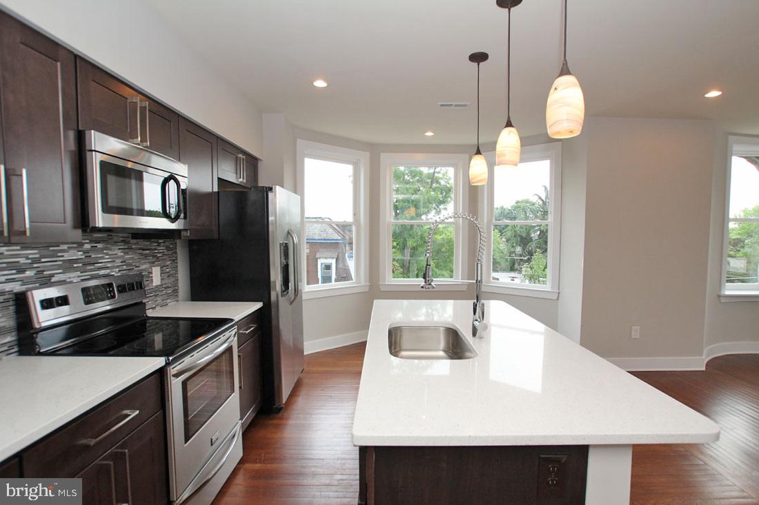A stunning unit in the Sedgley for rent! All the units in this rehabbed corner property include a wide variety of fantastic finishes and features, including central air, reclaimed pine hardwood flooring, recessed lighting, ceiling fans, high ceilings and large windows for tons of natural light. Enter and discover the large unit with an open and inviting living and dining area, showcasing the kitchen which includes quartz counters, subway tile backsplash and electric stainless steel appliances. The unit also features two light filled bedrooms which include tons of closet space, as well as two tiled bathrooms with quartz counter vanities. Washer and dryer are included in the unit, and bike storage is available in the basement for your comfort and convenience. This pet friendly building is close to universities, hospitals, shopping and public transportation, leaving you just minutes away from Center City.