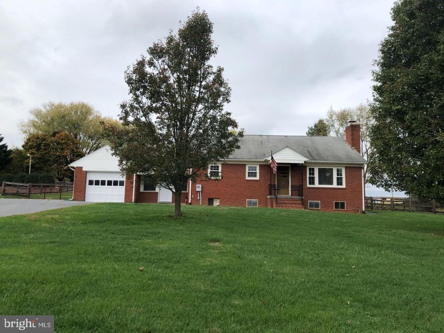 Awesome opportunity to own over an acre less than one mile to downtown Lovettsville's shopping and dining! This spacious rambler boasts a large family room with a cozy fireplace, a spacious kitchen that could be opened up to create an open floor plan, huge, fully fenced backyard with a little mountain view. Just across the street is a peaceful, quaint bed and breakfast. Enjoy sitting on the front porch and watch the sheep graze across the way. Just minutes to the MARC train and brand new grocery store in Brunswick. With a little TLC, this could be a wonderful home in a great location!