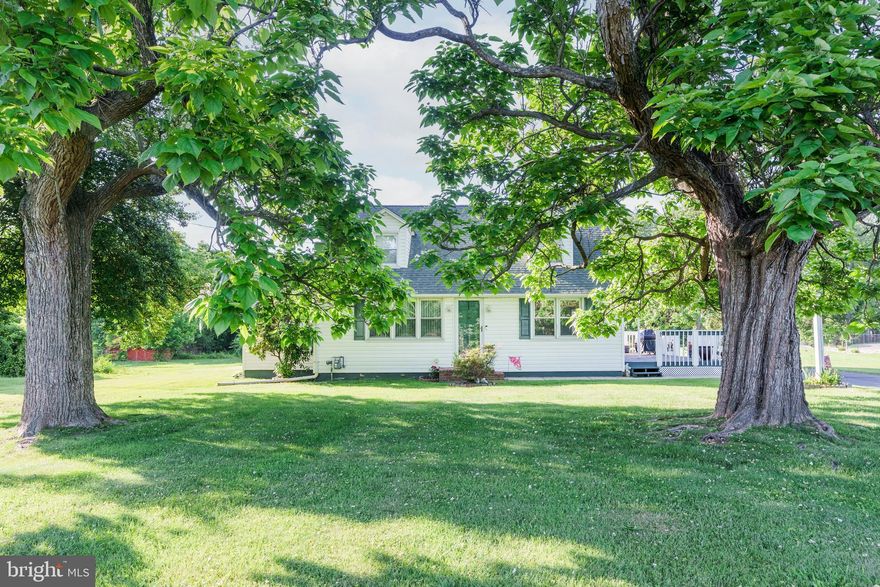 Pride of ownership shows in this home that the original family has owned for over 50 years. Residential/Commercial zoning offers endless possibilities. The main level features hardwood flooring, an eat-in kitchen with ample cabinet and counter space, a double oven, and a cooktop. A spacious family room with a wood-burning fireplace leads to the sunroom, perfect for morning coffee or a home office. Two main-level bedrooms and a full bath plus an additional three bedrooms and another full bath on the upper level. There is hardwood flooring under the carpet upstairs. Spacious deck,  large driveway that offers plenty of parking plus a detached, oversized two-car garage (24x32) and shed with electric. Convenient to the Delaware line, restaurants, and shopping.