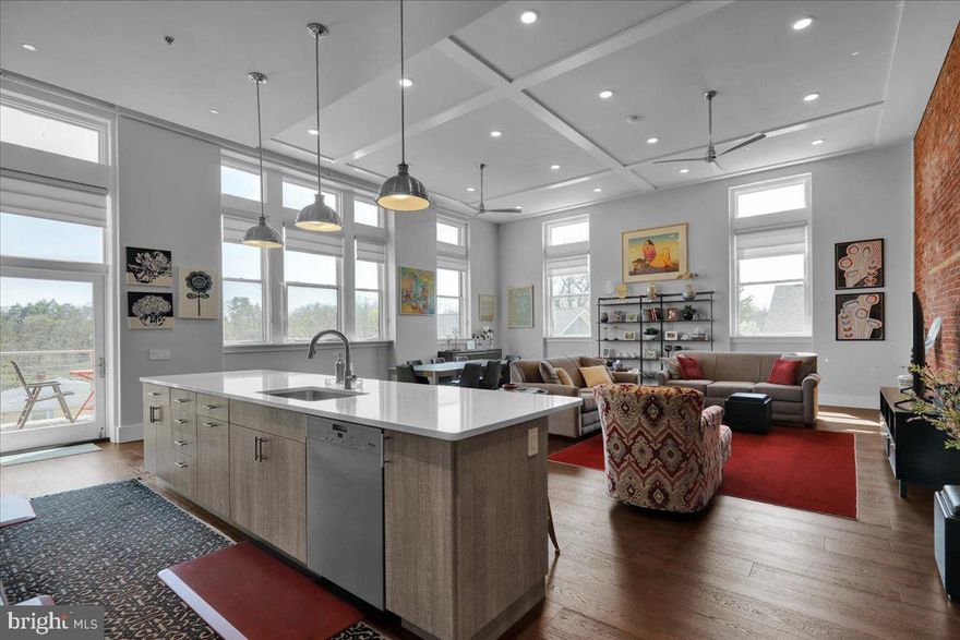 Penthouse-Style Condo with Private Deck & Designer Finishes  -  

Perched on the top floor of the beloved old Wyomissing Art Institute building, this modern condo offers quiet, elevated living on a quiet street just steps from the park system and minutes from the hospital, schools, and Penn Avenue amenities.  -  

Step inside, where a welcoming foyer with oversized doorways exposes all the designer finishes and traditional touches that make this building truly one-of-a-kind.  -  

The great room is wrapped in high-end hardwood flooring for a clean, modern look that’s easy to care for, and brightened by several tall windows, soaring ceilings with recessed lighting, ceiling fans, and wood details, and a statement-making brick accent wall.  -  

The kitchen is both a chef and entertainer’s dream with newer stainless-steel appliances, including gas range and hood, massive eat-in island with vegetable sink, tile backsplash, soft gray cabinetry, and quartz countertops.  -  

The open living and dining space flows naturally toward the private deck, extending your living area outdoors and creating an easy spot to enjoy morning coffee with views of the Boro playground and park below.  -  

Just off the kitchen, a former pantry has been converted into a dedicated laundry area, right where you need it for everyday convenience, while an adjacent bonus space offers the perfect nook for a sun-soaked home office.  -  

The Master bedroom is set up as a true retreat, with multiple tall windows, a high ceiling with recessed lighting and ceiling fan, light carpeting, and a large walk-in closet outfitted with built-in organizers.  -  

The private bath features a His and Hers vanity with a quartz top, step-in tile shower with glass door, and tile flooring to deliver a clean, updated feel with plenty of storage and spa-like appeal.  -  

A secondary bedroom enjoys the same soaring ceilings, tall window, and carpeting for comfort. Down the hall, past the exposed brick accent wall that adds warmth and character to the sleeping quarters, there’s a hall bathroom with tile flooring, large vanity, and tile tub/shower.  -  

Reserved covered parking, a shared outdoor terrace, fitness room, and private storage all add to the convenience and luxury to make this high-end, low-maintenance condo a rare find in the heart of Wyomissing.