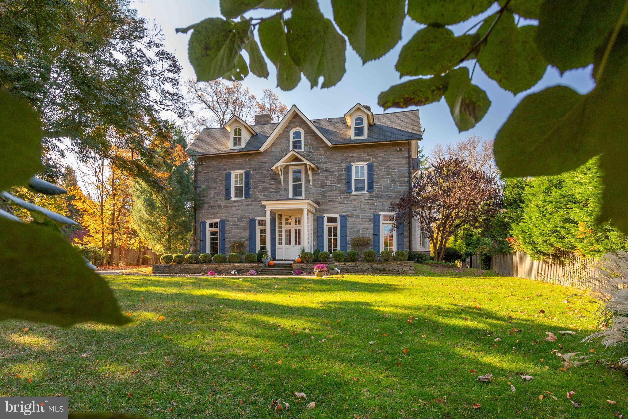 DRAMATIC REDUCTION. Move right in to 8614 Montgomery Avenue, one of the most desirable locations in Wyndmoor, just a short walk to Chestnut Hill. A truly spectacular property, built circa 1880, in the Victorian style, this magnificent, completely renovated stone residence is beautifully sited on .69 acres. The first floor features a brightly lit, gracious floor plan with exquisite architectural details and moldings, meticulously and lovingly maintained. Gracious center hall with handsome staircase is a warm welcome for family and friends. Paneled library to the left and formal living and dining rooms with fireplaces to the right. The fabulous gourmet kitchen/family room is a total knockout; featuring Viking appliances, custom cabinetry, quartz countertops, multiple islands, butler's pantry with wine refrigerator and informal dining space with built in seating. Large mudroom and laundry completes an ideal setup for every day living. Upstairs, in addition to a cozy master suite, two floors of bedrooms, baths, office, gym and comfortable living spaces. Clean, dry basement just waiting to be finished. Outside, enjoy a newly installed flagstone terrace with fire pit and covered, heated dining area. Take advantage of a wonderful opportunity to enjoy an exceptional #turnkey lifestyle, in a private setting, within walking distance to the Chestnut Hill and Wyndmoor villages, schools, transportation and the Wissahickon Valley trails. Please see link to video.