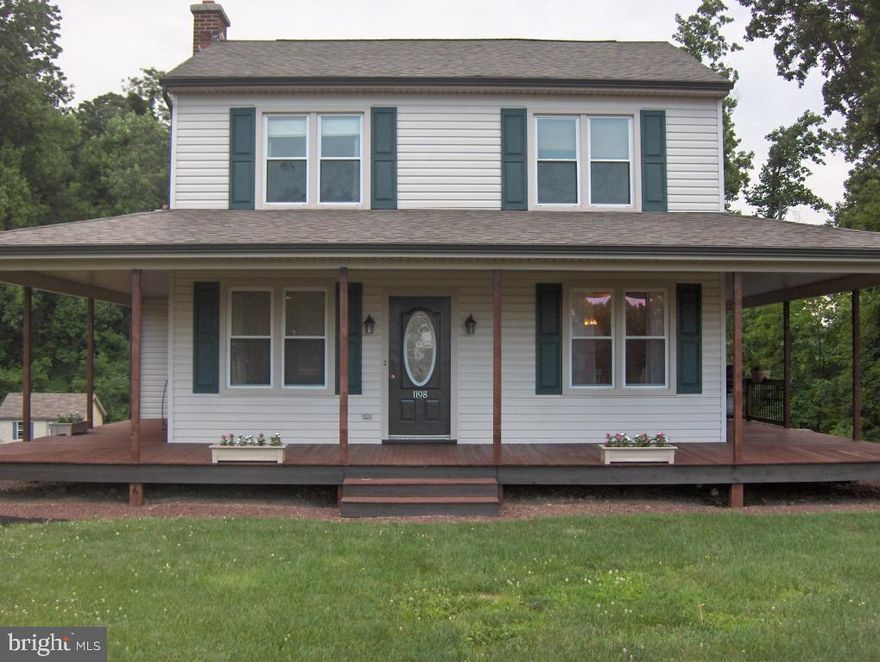 Beautifully remodeled home with 3 bedrooms & 2 baths on 2.6 acres. Mahogany wrap around porch with rear deck looking over expansive lot. Refinished hardwood flrs & new paint throughout. New Carpet. Fireplace in living room. New bathroom. This is a must see home!