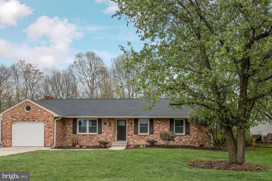 Beautifully renovated & conveniently located! New hardwood. New carpet in bedrooms. New kitchen complete w/ soft close cabinets, granite, backsplash, & SS appliances. Warm family room w/ wood burning fireplace. Master has attached full bath. Baths new with custom tile. New paint & lighting throughout. Great deck for entertainment. Fenced in back yard w/ shed. Concrete driveway & attached garage.