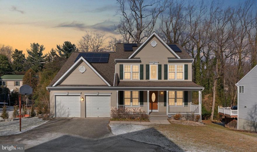 Beautifully maintained and thoughtfully updated 4-bedroom, 2.5-bath single-family home tucked away on a quiet street in Hanover, backing to woods for added privacy — and NO HOA. A welcoming covered front porch sets the tone, perfect for morning coffee or evening relaxation. Offering over 2,300 sq ft above grade, this home features a two-story foyer, fresh neutral paint throughout, new carpet, and luxury vinyl plank flooring on the main level.

The main level offers a flexible layout with a living room and dining room with updated molding, a private den/home office, and a spacious family room with a gas fireplace. The kitchen includes a breakfast island, pantry, dishwasher, microwave, and slider access to the upper deck, ideal for entertaining or enjoying the peaceful backyard setting. A second lower deck provides even more outdoor living space.

Upstairs, the primary suite features a large walk-in closet and an updated bath with dual sinks and tile finishes. Additional bedrooms are generously sized with updated lighting and plenty of closet space! Don't miss the upper-level laundry, too!

The unfinished walkout basement offers outstanding future potential with a rough-in for plumbing, making it easy to add an additional bathroom or expanded living space, while also providing excellent storage and workshop area with direct access to the rear yard.

Major updates include a new furnace (2024), windows replaced in 2005, hot water heater in 2021 and a 50-year architectural roof with transferable warranty replaced in 2018. Additional highlights include a 2-car garage with EV pre-wiring, extra driveway parking, and a private wooded lot.

Solar panels are leased through Tesla and will be assumed by the buyer. The current payment is approximately $48.87/month, with sellers consistently receiving annual rebates that provide energy savings.

This house is ready for immediate occupancy, so don't wait!

Conveniently located near major commuter routes, shopping, and dining, and zoned for Howard County’s newest high school, this move-in-ready home offers space, privacy, and long-term value.

**Multiple offers are expected, the sellers have set a deadline of Sunday at 5pm**