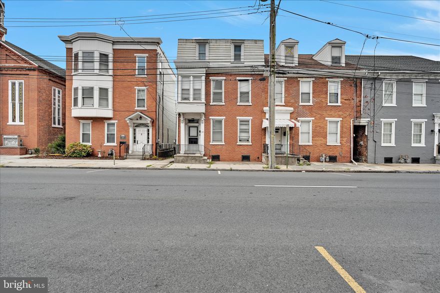 Welcome to this spacious and beautifully updated semi-detached home offering over six bedrooms of versatile living space- perfect for growing households, multigenerational living, or those needing extra room for work, hobbies, or guests.
Step inside to a large family room filled with natural light and charm. The modern kitchen features an island, pendant lighting, ample cabinetry, and plenty of space to gather and entertain. 
A cozy bedroom walks out to its own private balcony, offering the perfect spot for morning coffee or evening relaxation.
Upstairs, the finished attic showcases exposed brick, adding character and warmth to the home. Additional highlights include ceiling fans throughout, updated fixtures, 2.5 well-appointed baths, and off-street parking for added convenience.

With so much space and personality at an incredible price point, this home is a must-see!

 Schedule your private showing today!