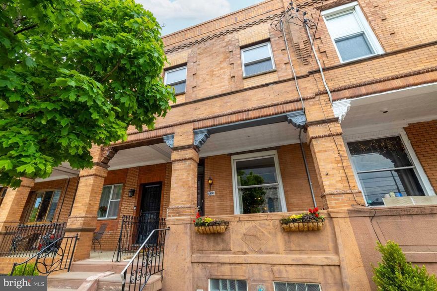Welcome to 1805 Wolf Street, a modernized front porch charmer in the heart of the lovely Girard Estates neighborhood. 1805 Wolf St is a spacious 1,450+ square foot row home that blends classic South Philly character with modern upgrades. The current owners have lovingly maintained and thoughtfully updated this classic beauty with central air, a show-stopping chef's kitchen, and a high and dry semi-finished basement with endless possibilities. This 16-foot-wide home features a traditional brick facade and a welcoming front porch perfect for morning coffee and evenings with friends and neighbors. The main floor opens to a substantial living room with high ceilings and gleaming hardwood floors that flow into a dining area, which conveniently includes a powder room. A massive 18x11 eat-in kitchen serves as the heart of the home, equipped with a huge butcher block island, high-end induction range, vented hood, farmhouse sink, and ample cabinetry. Upstairs, you'll find four proper bedrooms, including a large primary bedroom with charming built-in armoires and additional closet space, all serviced by a well-sized hall bathroom. The property includes a rear yard that's perfect for barbecues, as well as a semi-finished basement with ample space for recreation and additional storage. 1805 Wolf is just a short subway ride from Center City and convenient to I-76 and I-95, the stadium district, and FDR Park. This home offers high walkability and easy access to the best of South Philadelphia including the many shops and restaurants of Passyunk Avenue. Schedule your showing today!