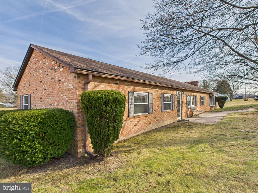 MAJOR PRICE IMPROVEMENT!

Situated in a highly desirable area just off Rt. 522, this Ranch on unrestricted land offers an easy commute while maintaining privacy and space. This hybrid modular brick rancher features a newer architectural shingle roof, central air and heat, and both propane and wood-burning fireplaces for year-round comfort.
Inside, you’ll find a spacious layout enhanced by a large living room addition, perfect for gatherings and everyday living. A rear sunroom addition provides a relaxing space to enjoy views of the backyard, while the rear deck extends your living area outdoors. The home was originally a 3-bedroom and has been thoughtfully reconfigured into a generous 2-bedroom layout by combining two bedrooms into one, offering flexibility to suit your needs. The septic system remains approved for a 3-bedroom home.
Set on 0.81 acres of unrestricted land, the property also includes a substantial detached 2-car garage/workshop—large enough that it once housed the famous 'Virginia Giant' monster truck—making it ideal for hobbyists, mechanics, or anyone needing serious workspace.
A rare opportunity in Frederick County with space, versatility, and a commuter-friendly location—this property offers endless potential.